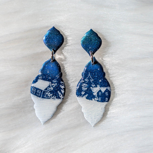 Curvy frame Aurora Borealis Christmas village polymer clay earrings with a snowy white imprint