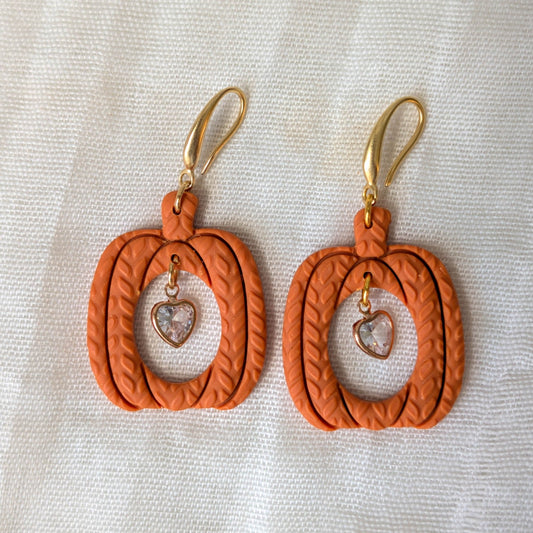 Burnt Orange knitted pumpkin earrings with clear heart charms and 14K gold-plated stainless steel hooks