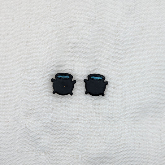 Black witch cauldron stud earrings with blue potion rims