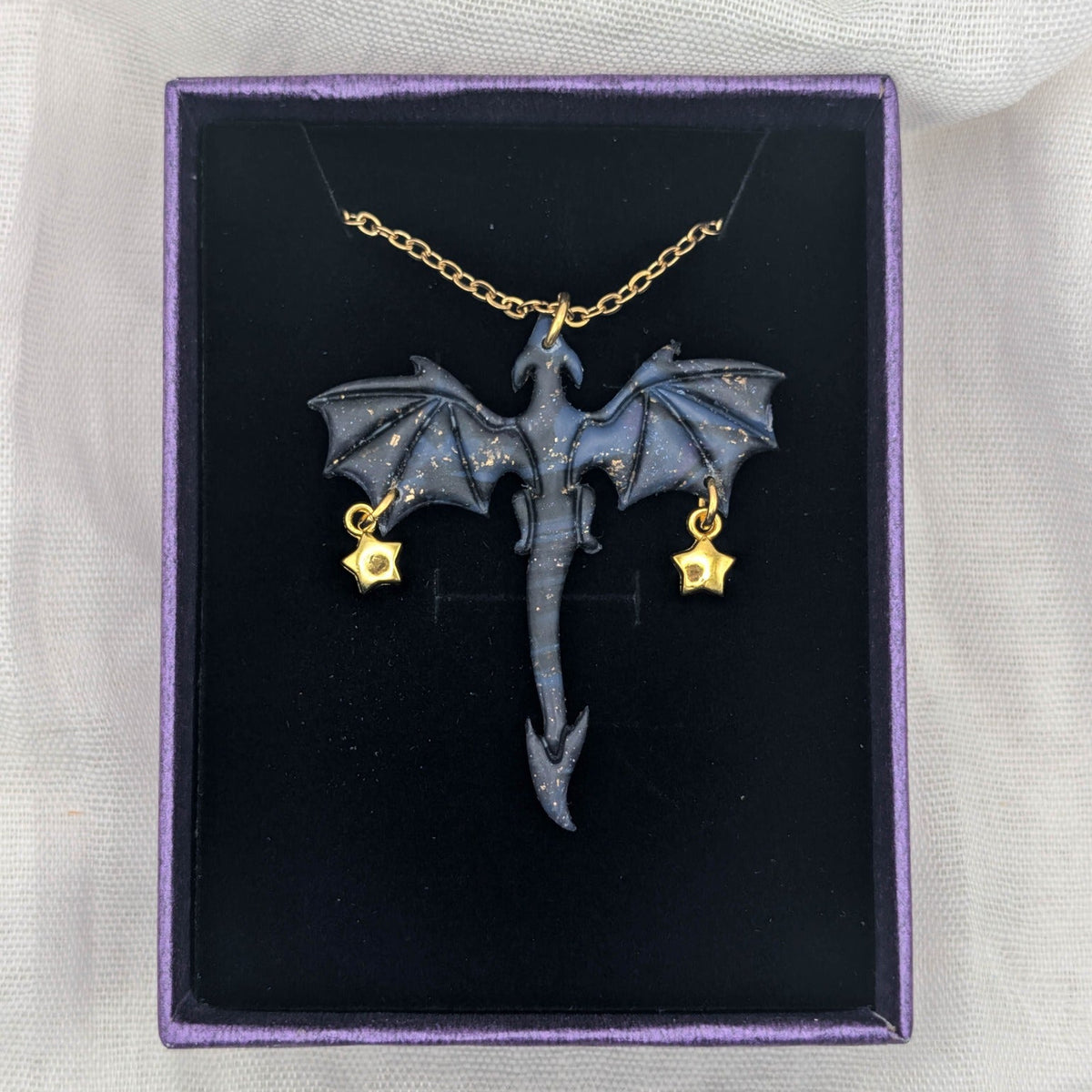 Marbled purple blue and black dragon necklace with gold chain and two petite star charms