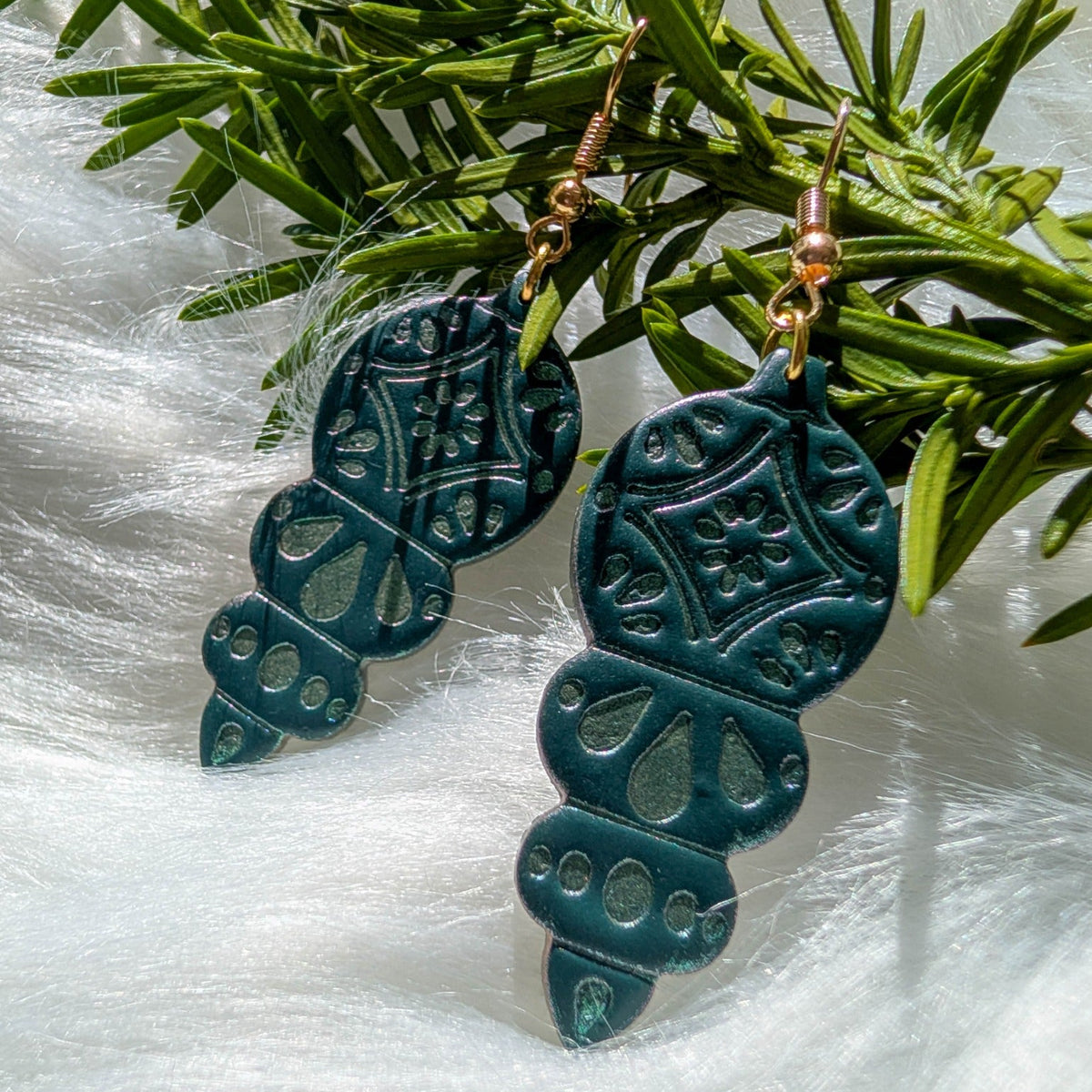 Green Christmas ornament dangle earrings with shimmering details and gold-plated hooks