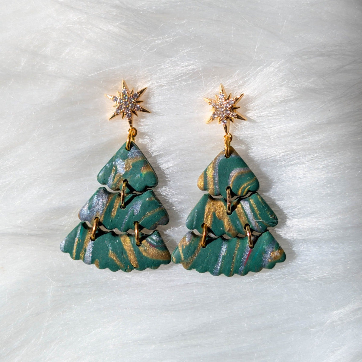 Pair of green layered Christmas tree earrings with gold and silver marbling