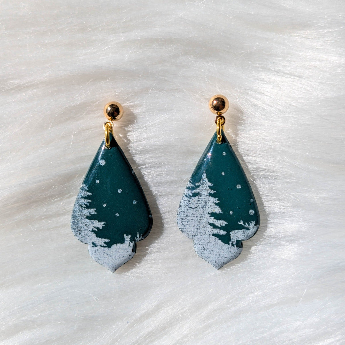 Green curved drop snowy forest earrings with white trees, deer and gold-plated stainless steel findings