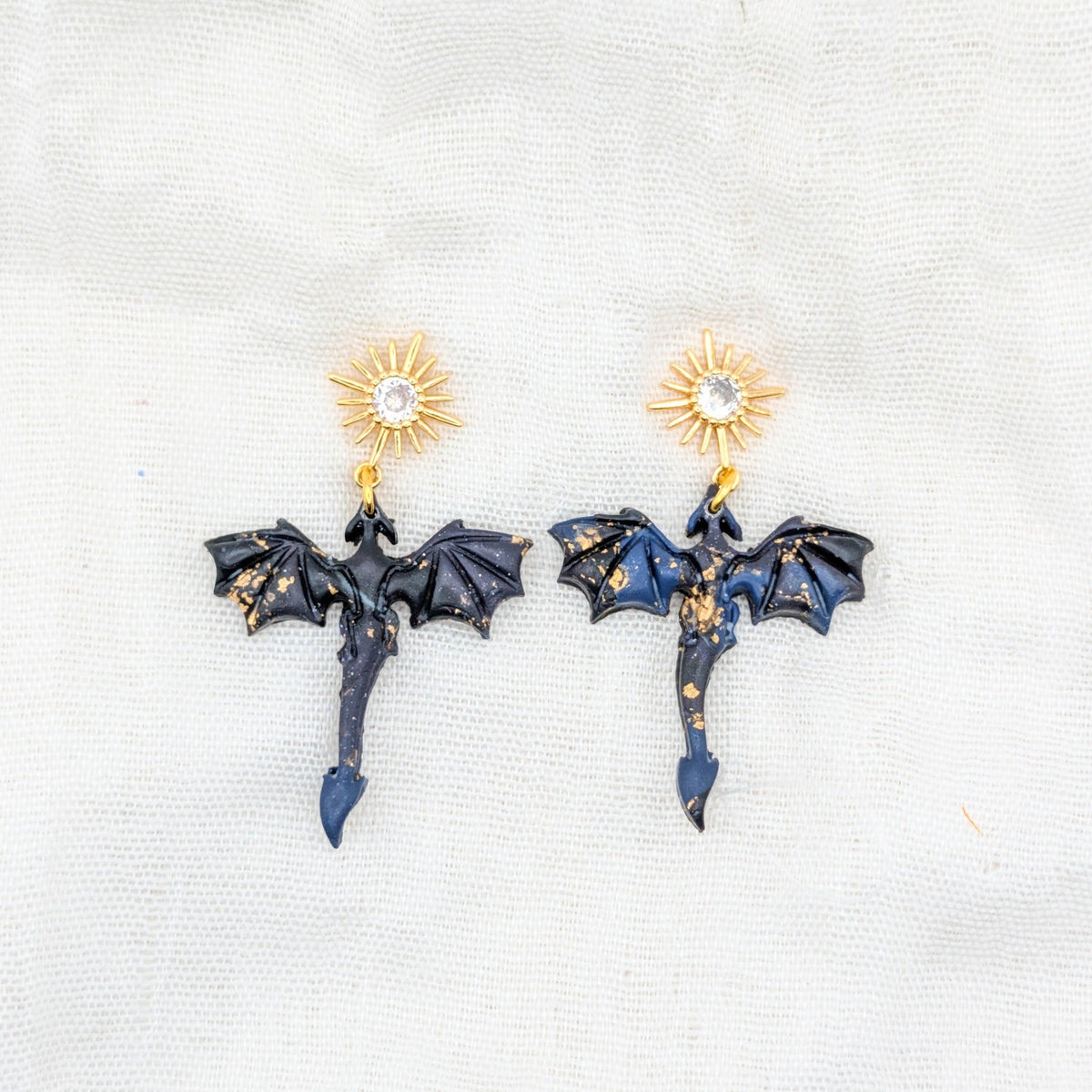 Small gold-flecked midnight marble dragon earrings with 24K gold-plated starburst cubic zirconia studs