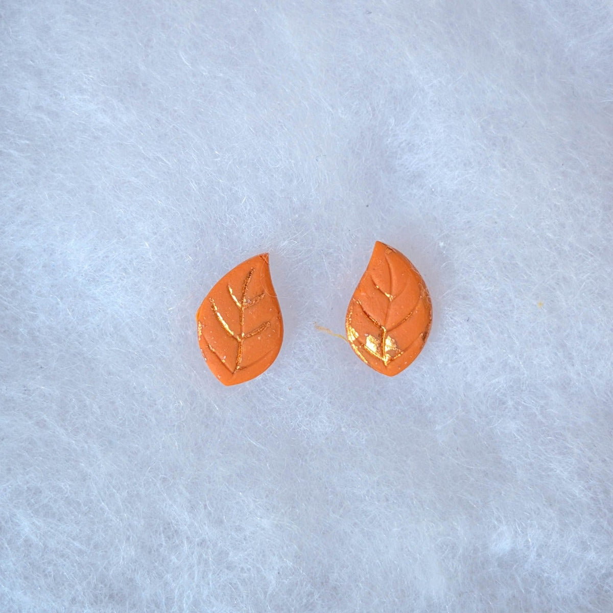 Orange autumn leaf stud earrings with copper veins and edging