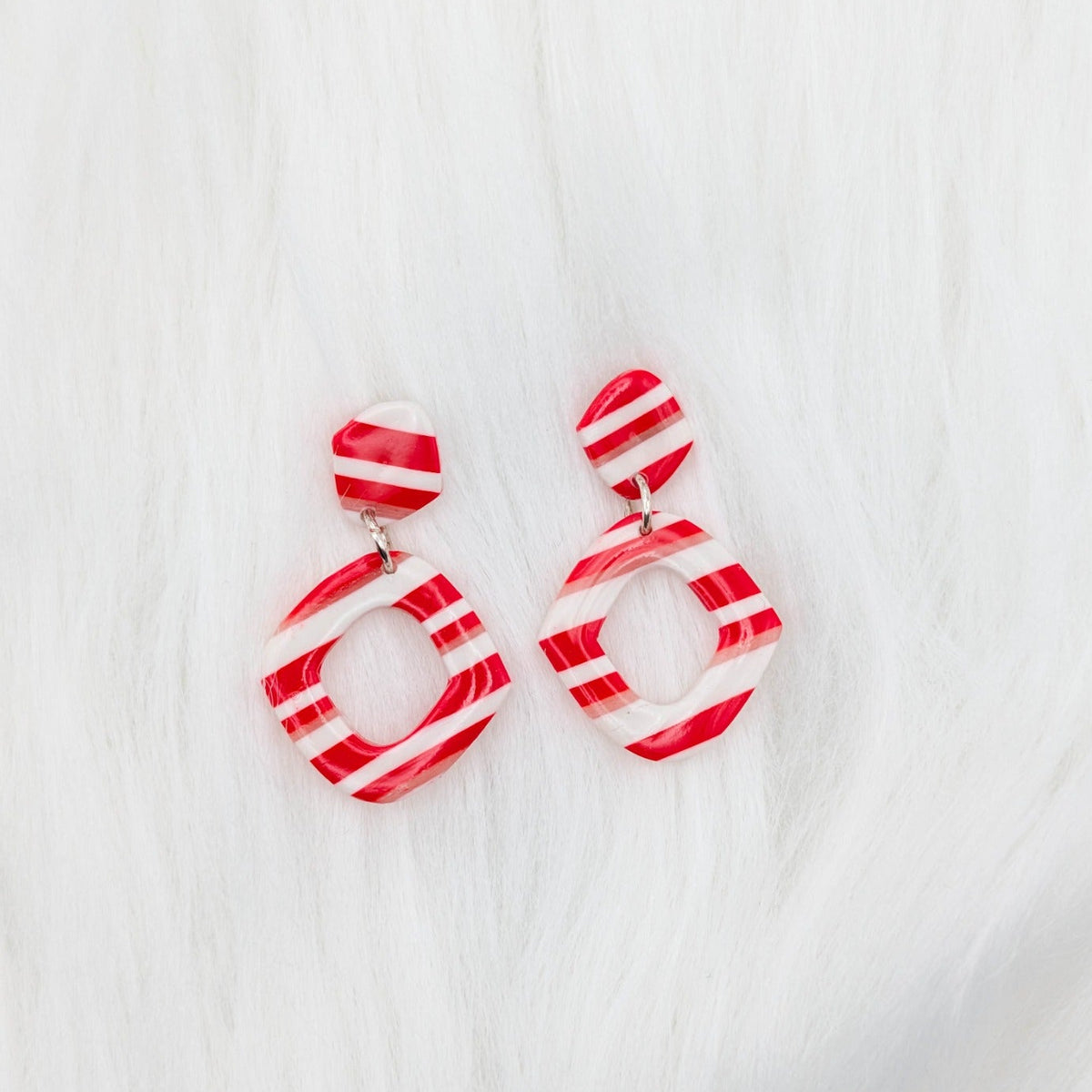 Double diamond drop earrings with red, white, and translucent candy cane stripes.