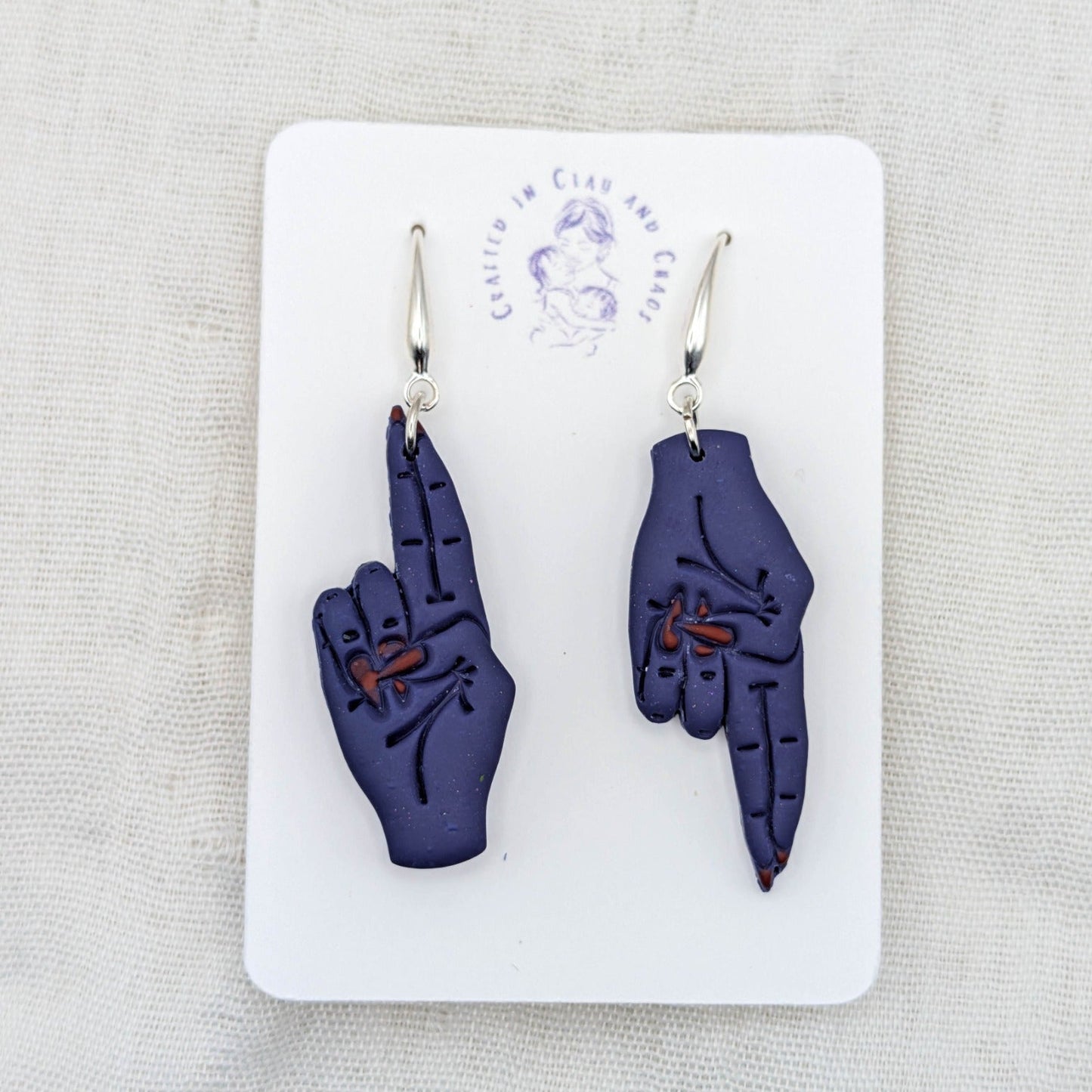 As Above, So Below mystical blue hand earrings with red painted nails and silver-plated hooks