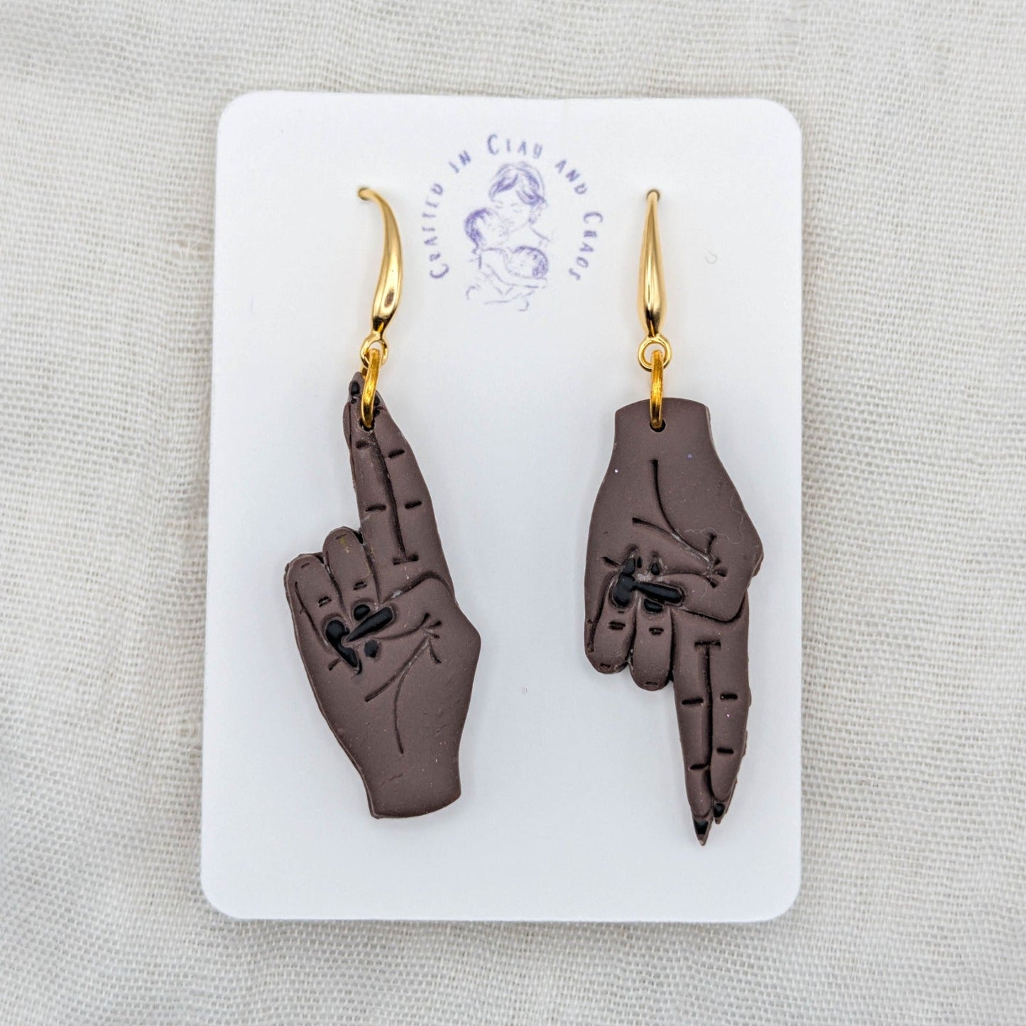 As Above, So Below deep brown hand earrings with black painted nails and 18K gold-plated hooks