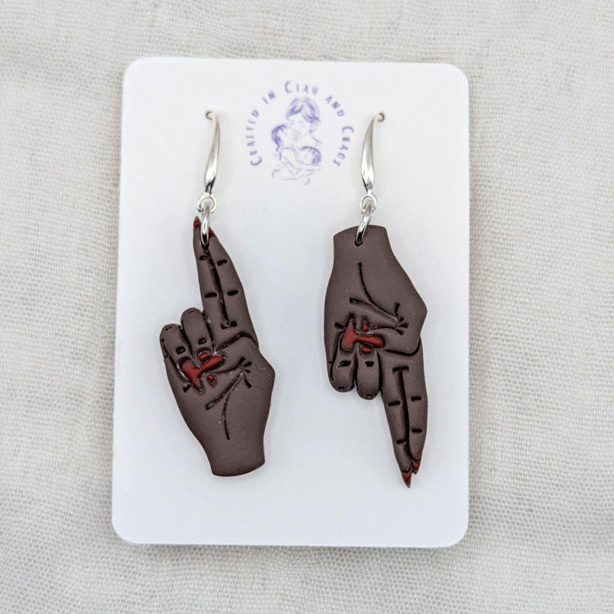 As Above, So Below deep brown hand earrings with red painted nails and silver-plated hooks