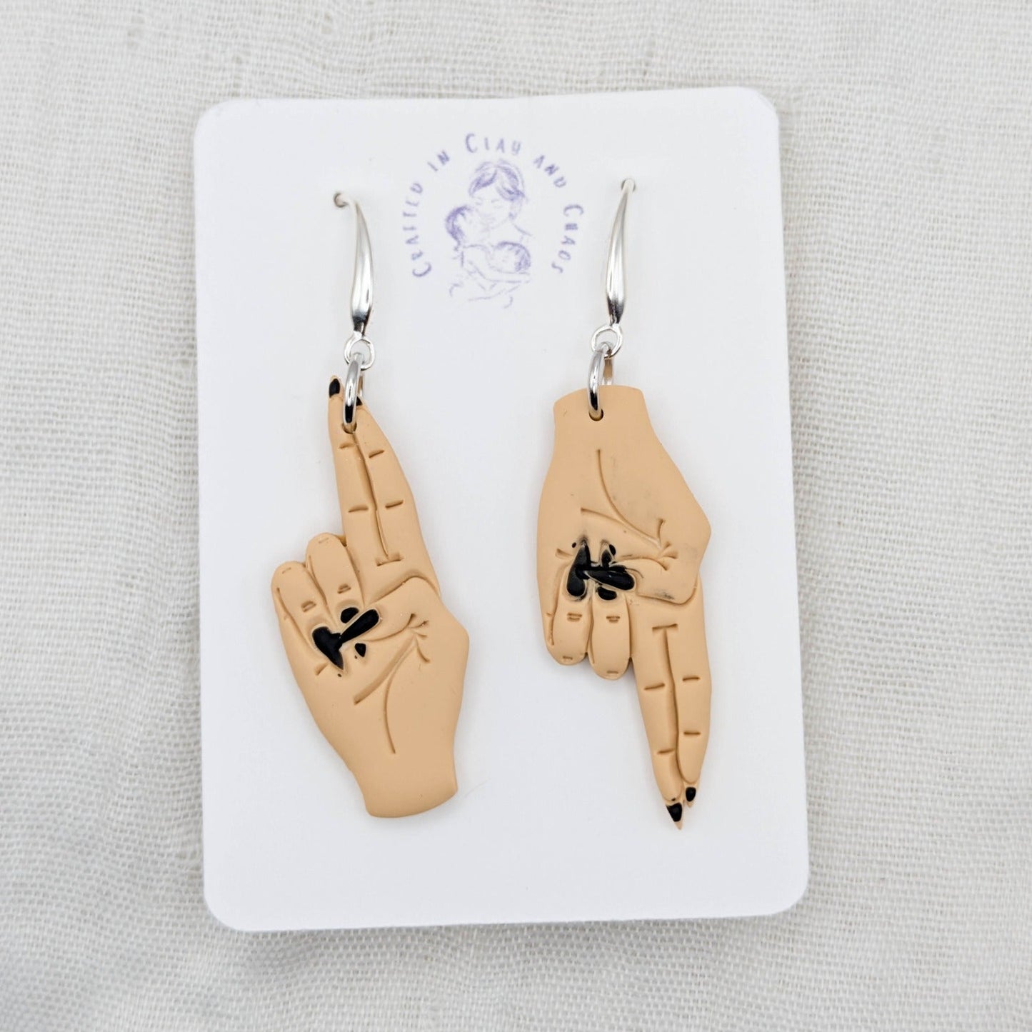 As Above, So Below golden tan hand earrings with black painted nails and silver-plated hooks