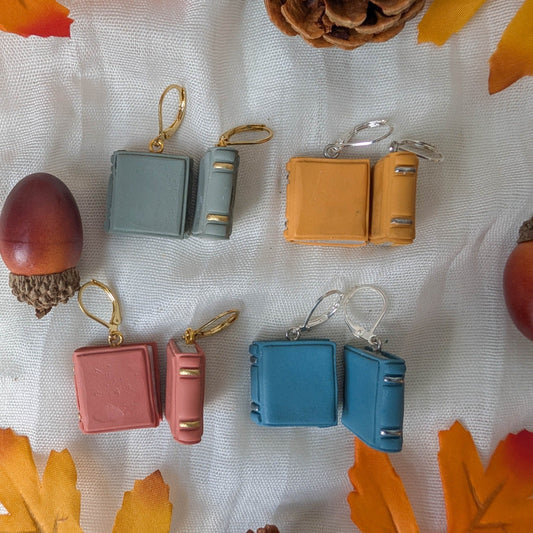 Smooth autumn book earrings in Sage Green, Mustard Yellow, Dusty Terracotta, and Vintage Blue