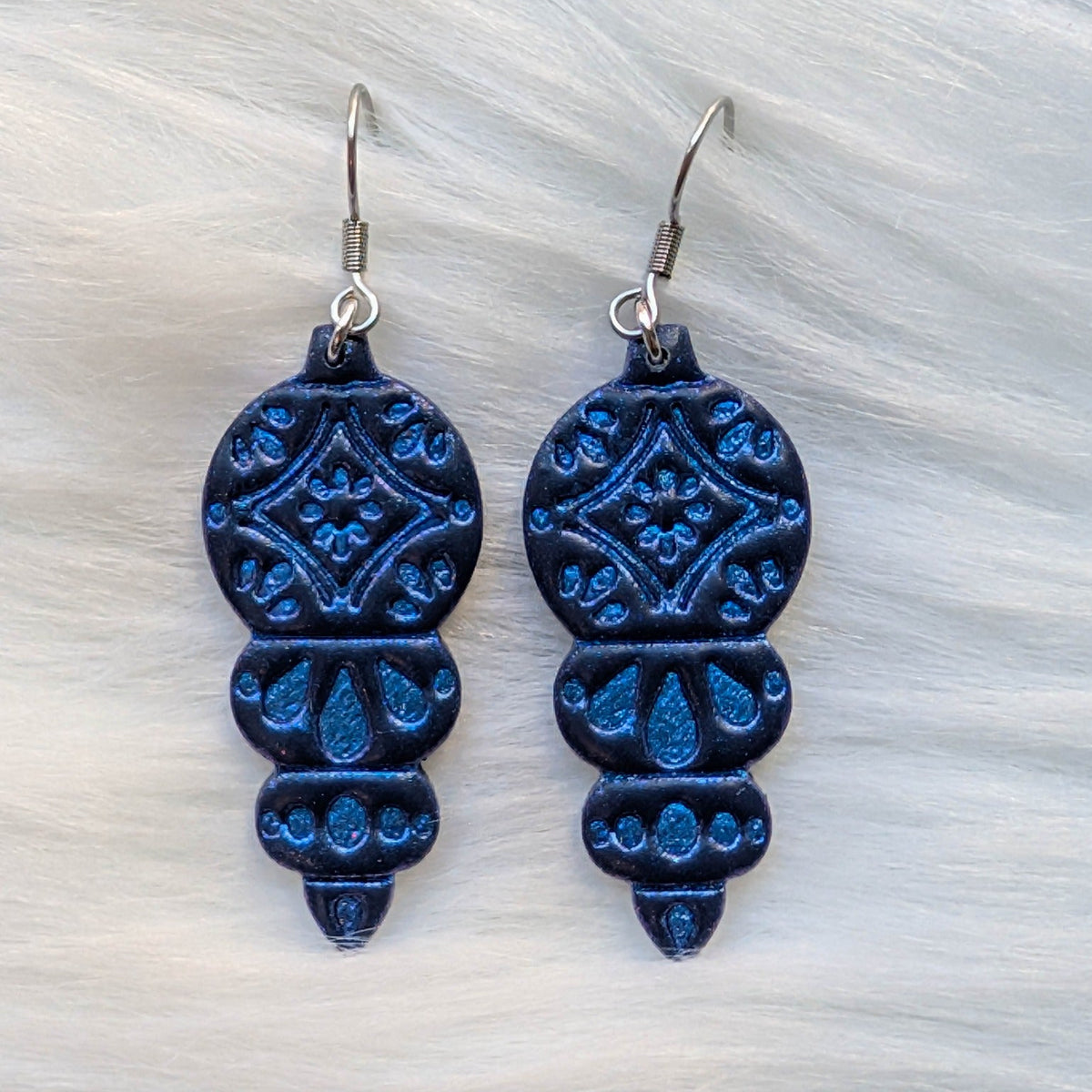 Blue ornament dangle earrings with shimmering details and surgical-grade stainless steel hooks