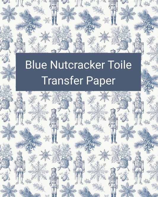 Blue Nutcracker Toile polymer clay transfer paper with nutcrackers, evergreen branches, snowflakes, and botanical accents in white, pale blue, denim blue, and navy