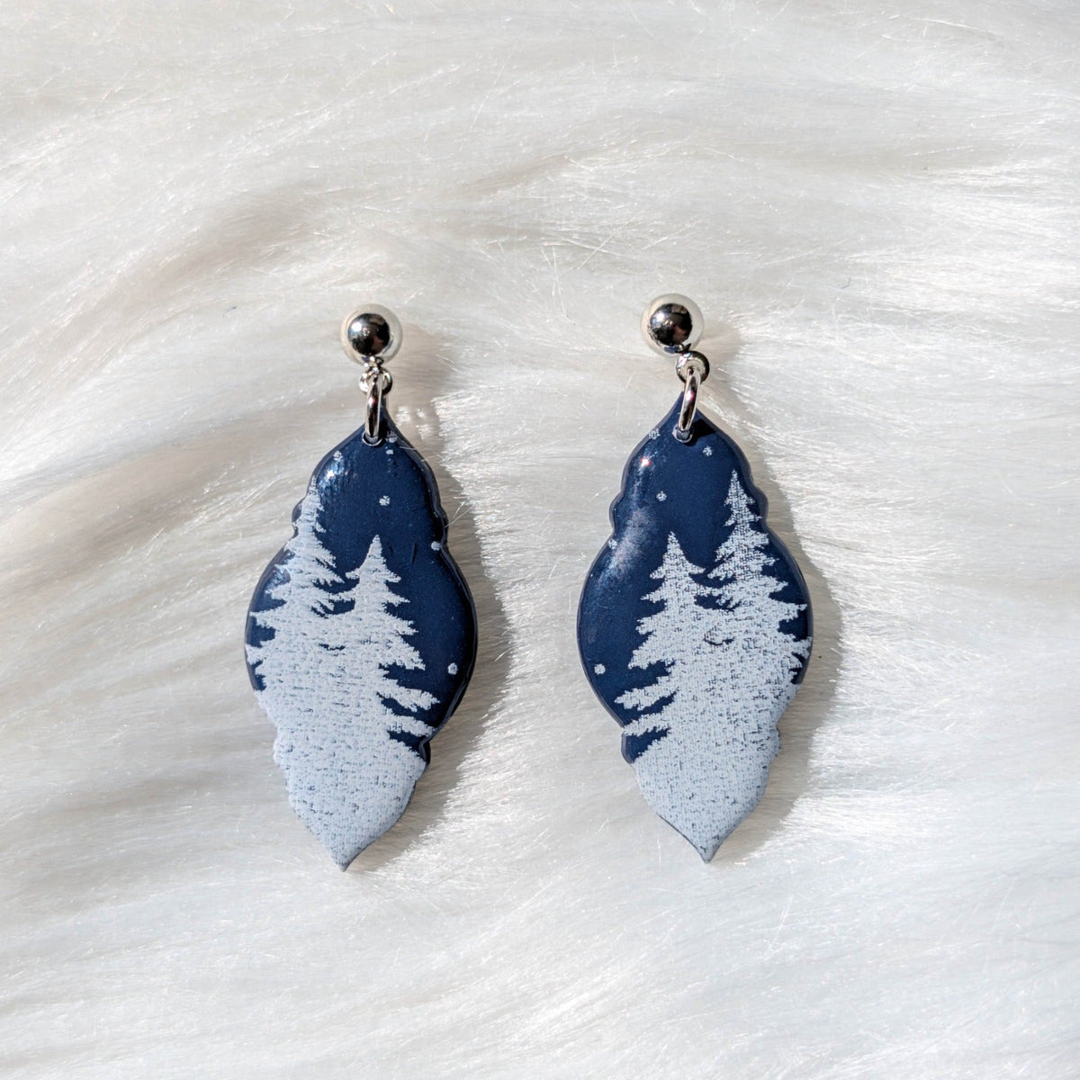 Blue curved drop snowy forest earrings with white pine trees and sterling silver-plated stainless steel findings