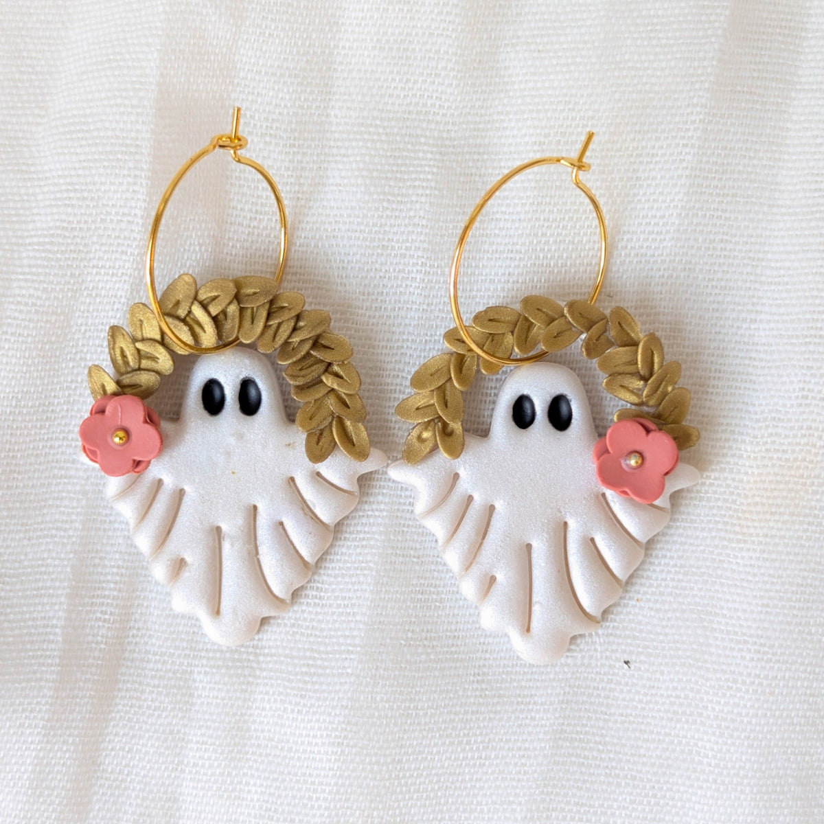Pearlescent botanical ghost earrings with gold leaf crowns, coral flowers, and gold hoops