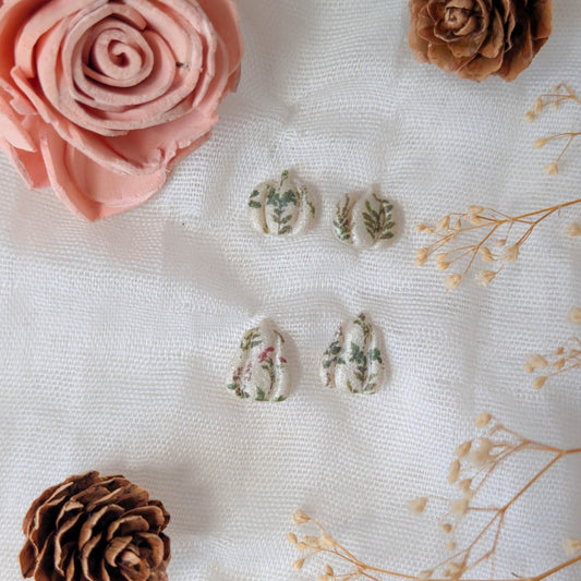 Rustic botanical pumpkin and gourd mini stud earrings styled with dried flowers and pinecones