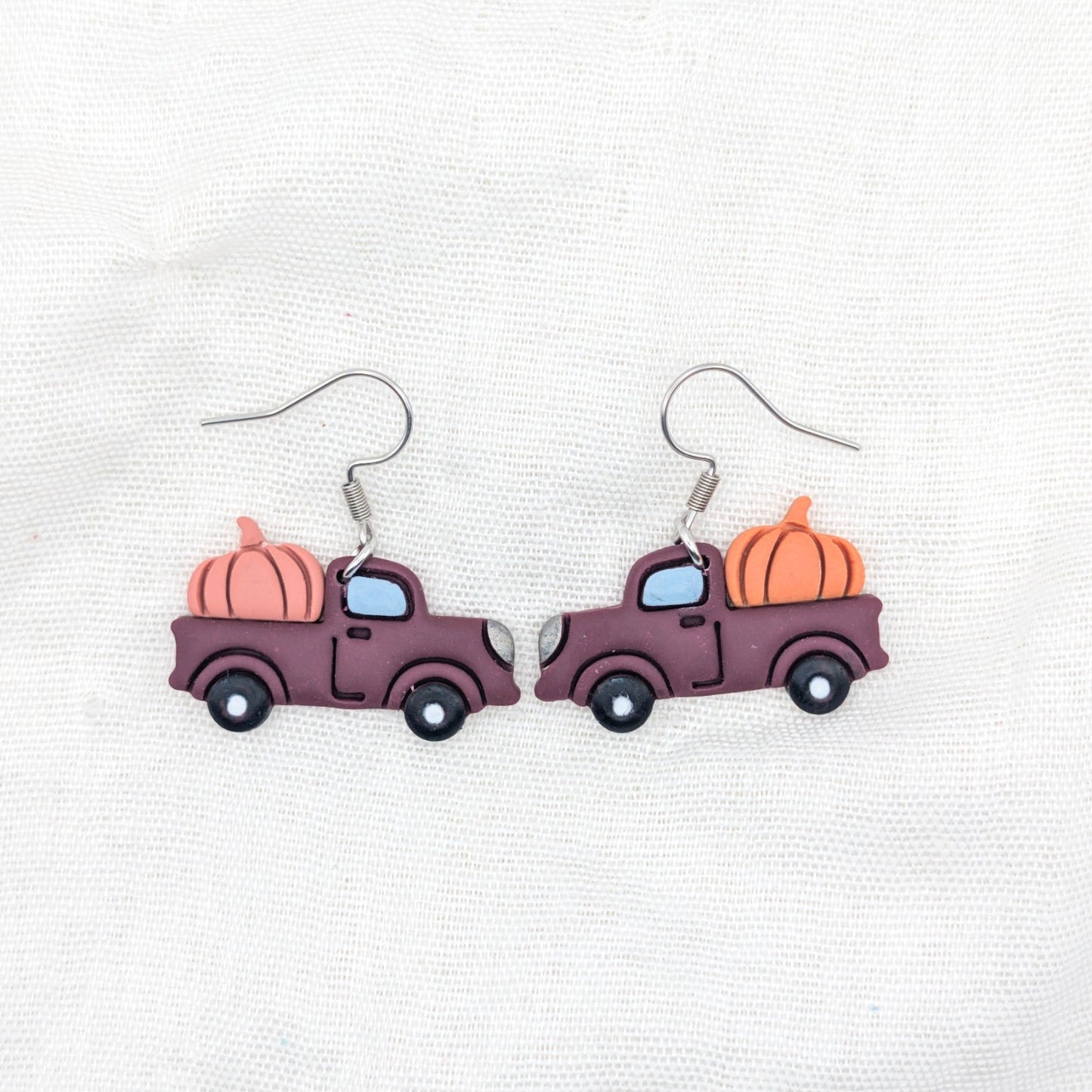 Burgundy pumpkin truck earrings with orange and coral pumpkins and stainless steel hooks