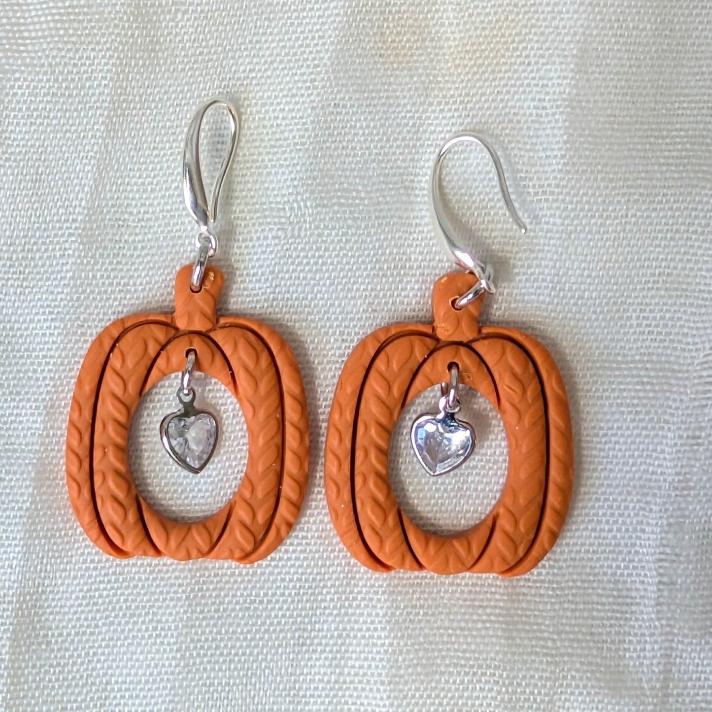 Burnt Orange knitted pumpkin earrings with clear heart charms and 925 sterling silver-plated stainless steel hooks