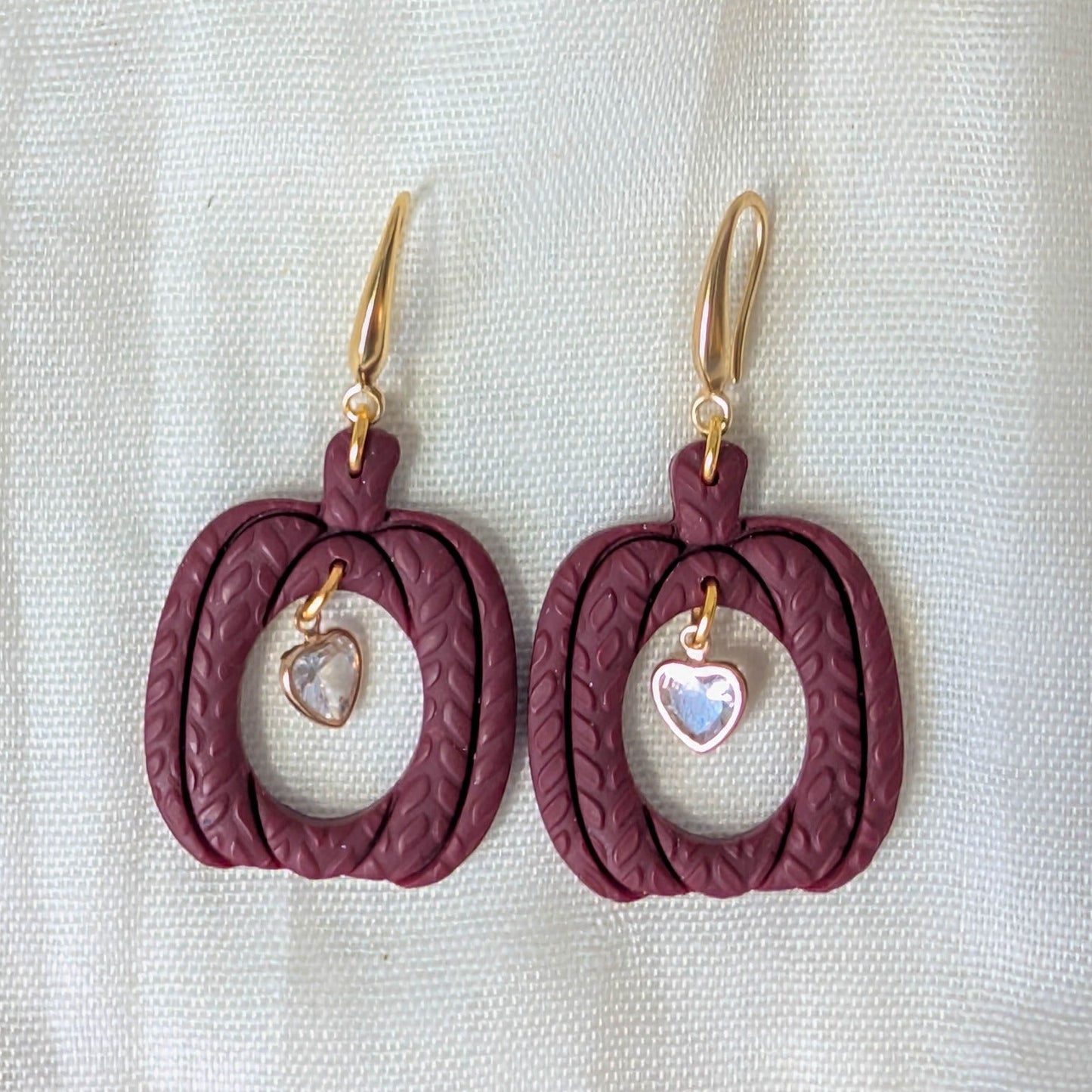 Crimson knitted pumpkin earrings with clear heart charms and 14K gold-plated stainless steel hooks