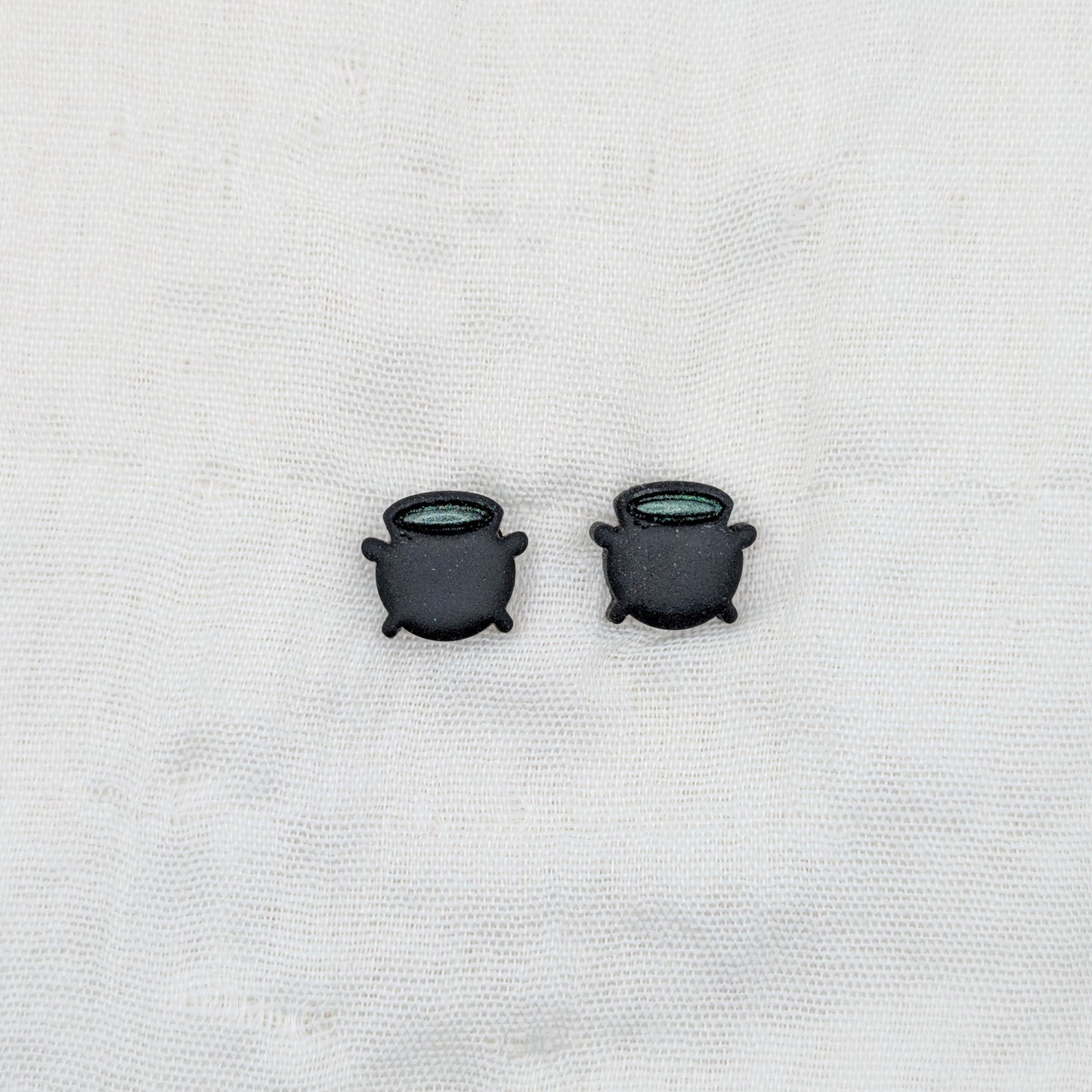 Black witch cauldron stud earrings with green potion rims