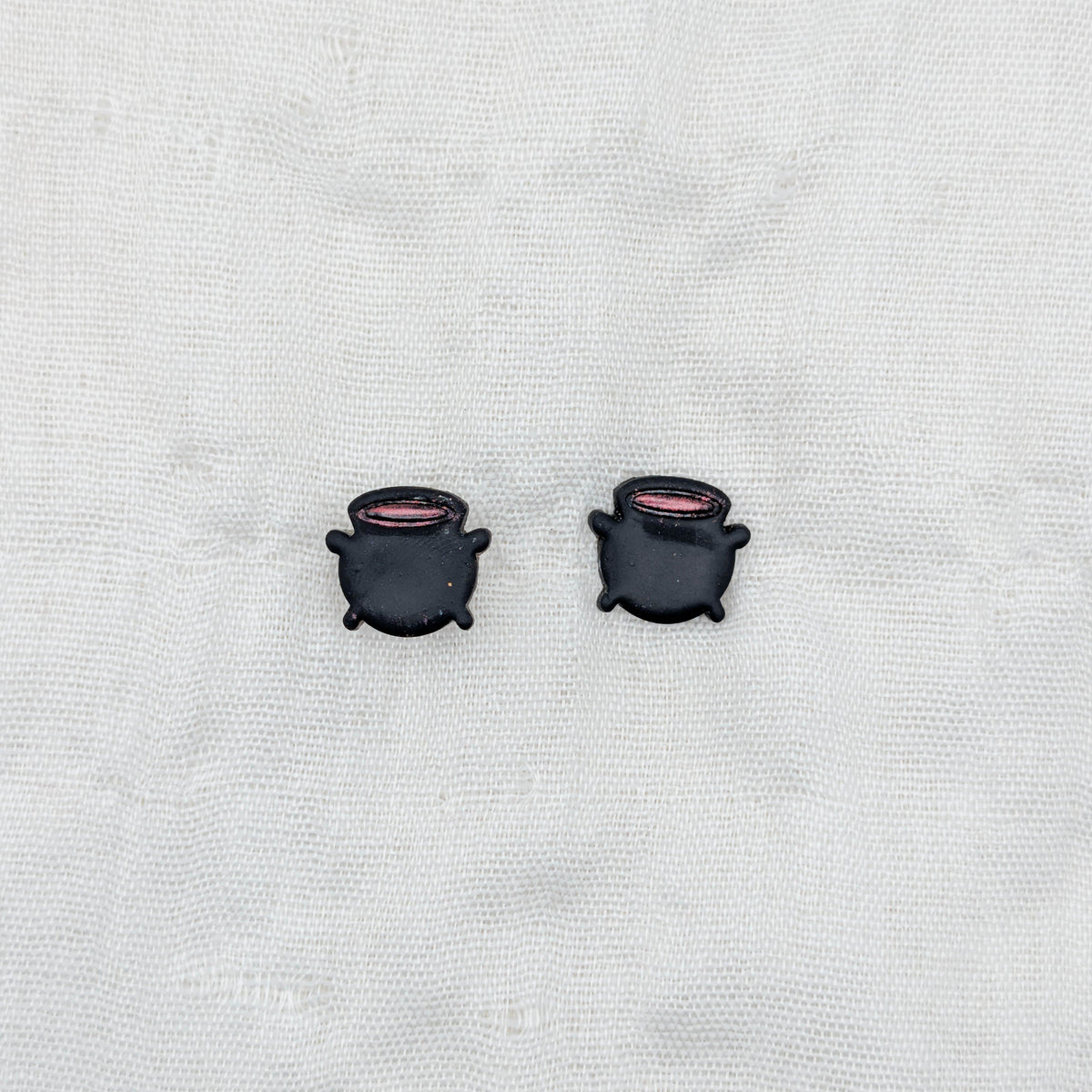 Black witch cauldron stud earrings with red potion rims