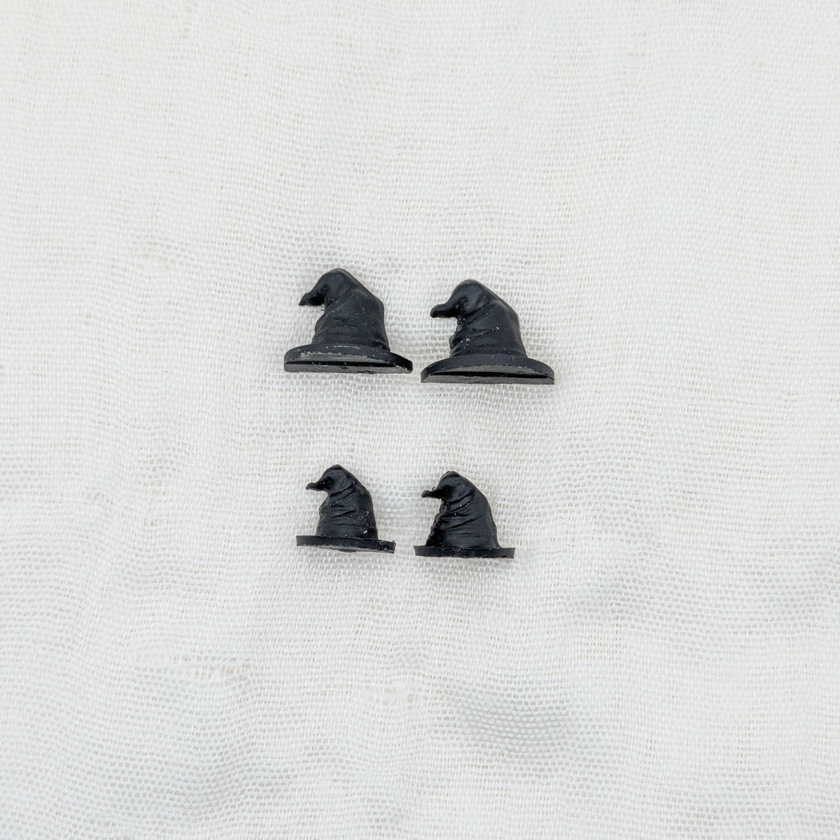 Small and mini handmade black 3D witch hat stud earrings shown together