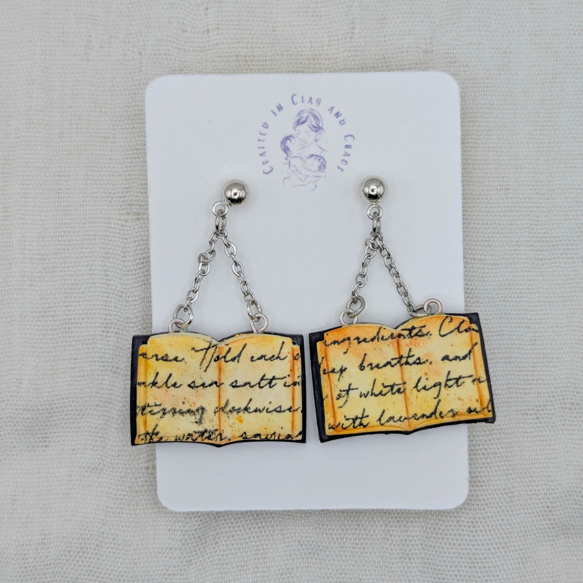 Deep Purple open spellbook earrings with silver findings