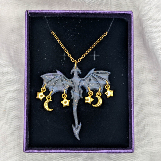 Gold marbled dragon necklace with three star and two crescent moon charms