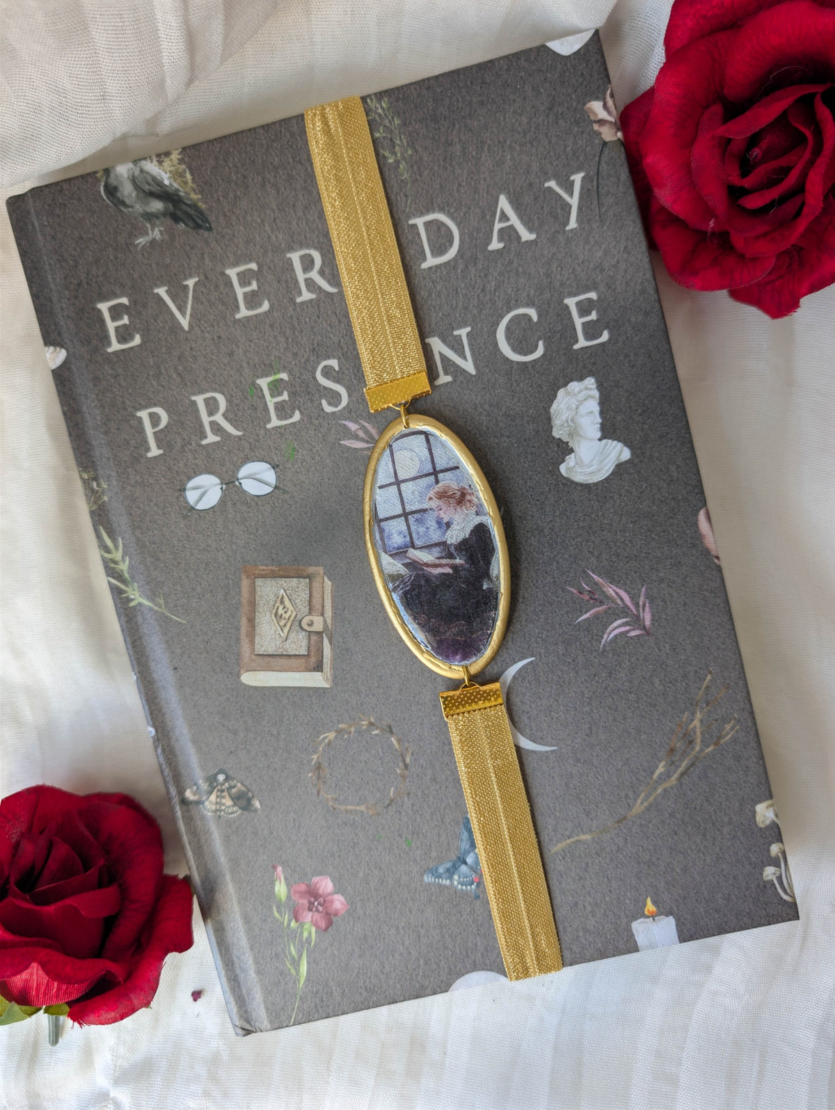 Gold moonlit reader polymer clay wrap-around bookmark styled on a gothic book with red roses