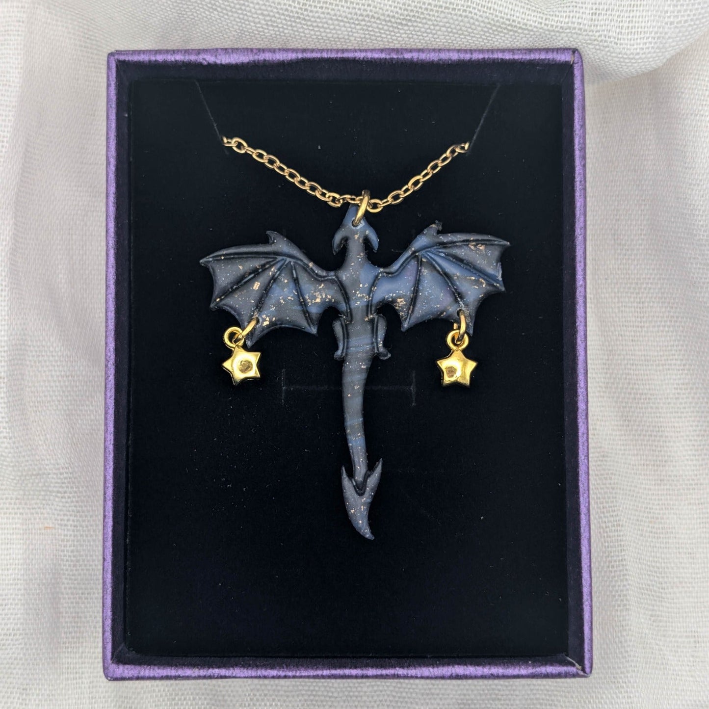 Marbled purple blue and black dragon necklace with gold chain and two petite star charms