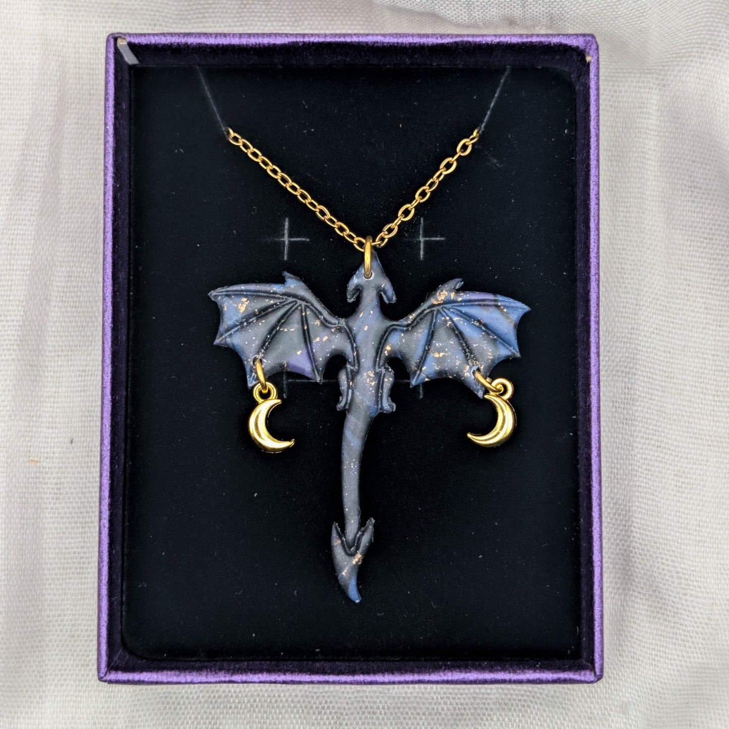 Marbled dragon pendant necklace with gold chain and two dangling crescent moon charms