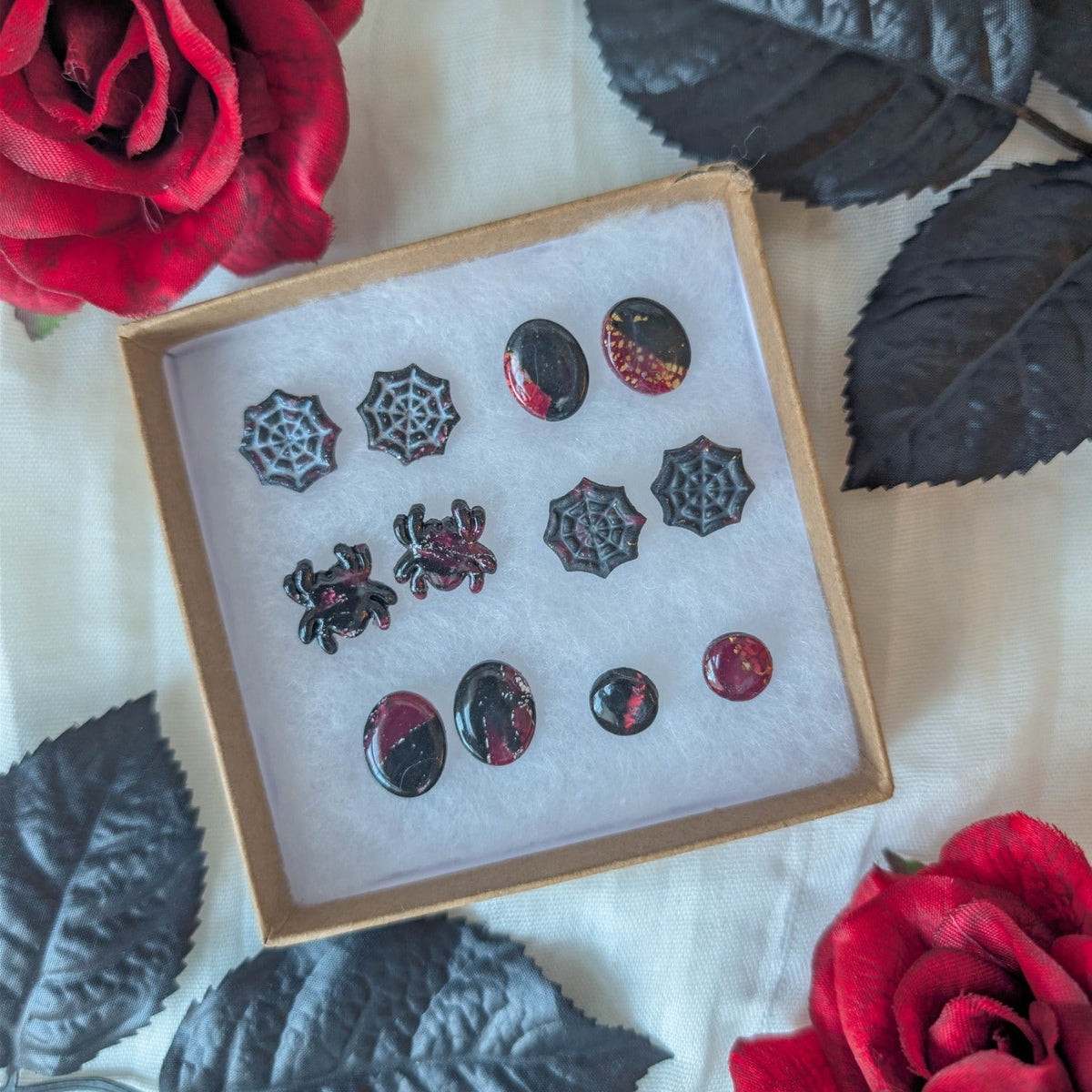 Collection of crimson and black vampire marble Halloween stud earrings in spider, cobweb, oval, and circle designs