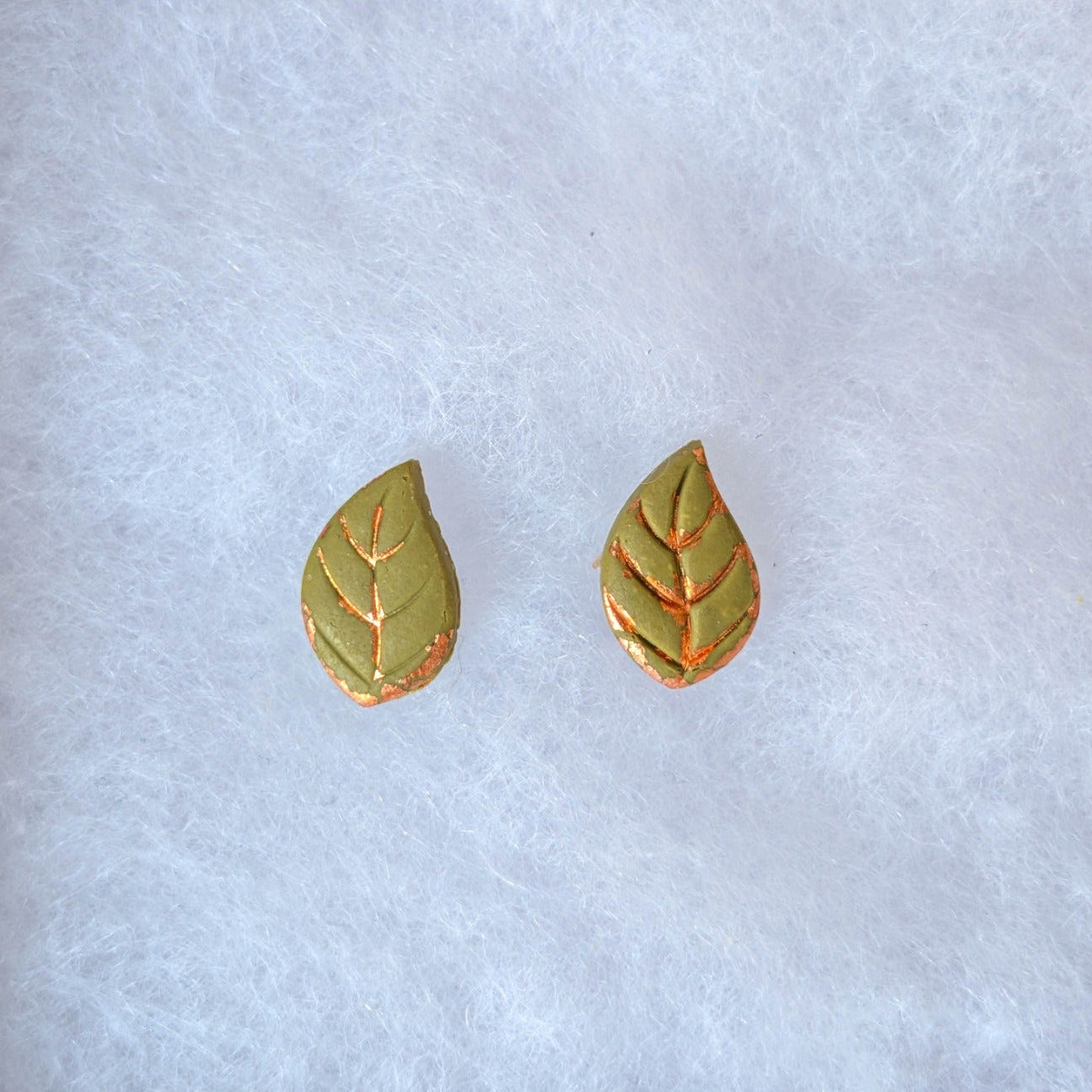 Green autumn leaf stud earrings with warm copper accents