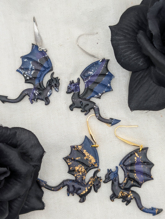 Gold- and silver-flecked midnight marble dragon earrings styled with black flowers, showing large hook options