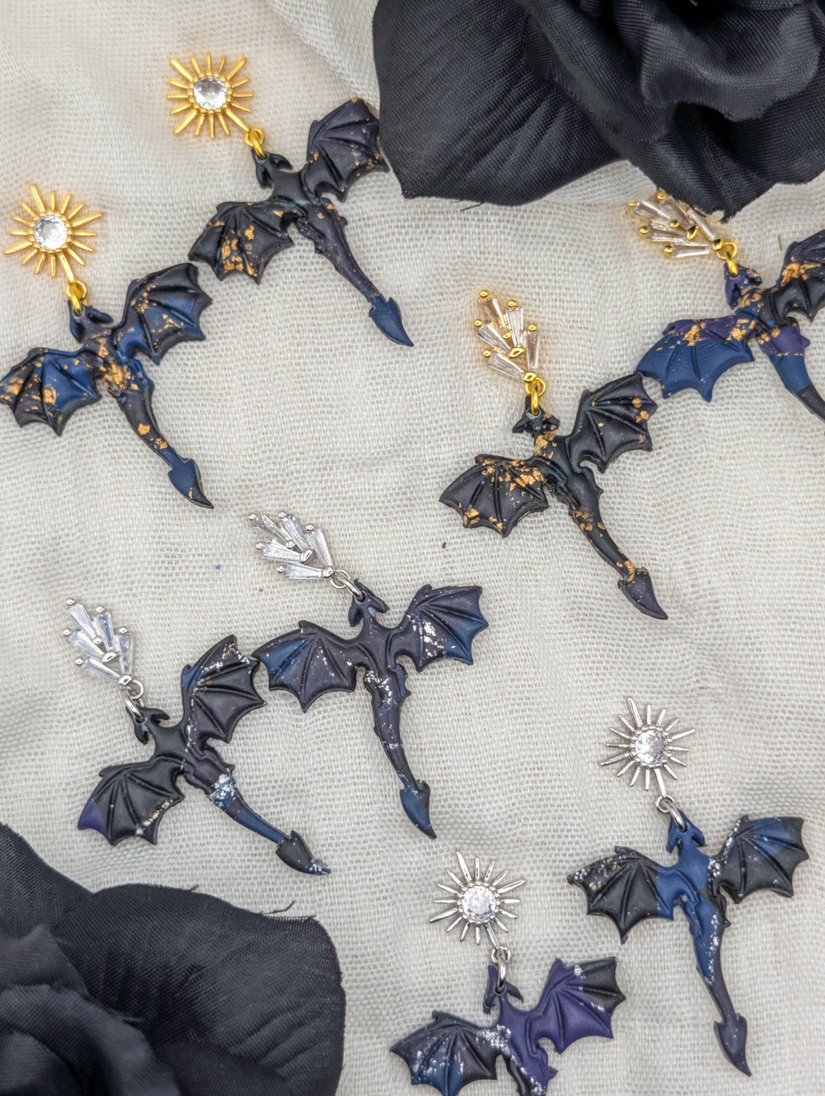Gold- and silver-flecked small midnight marble dragon earrings with starburst and leaf cubic zirconia studs