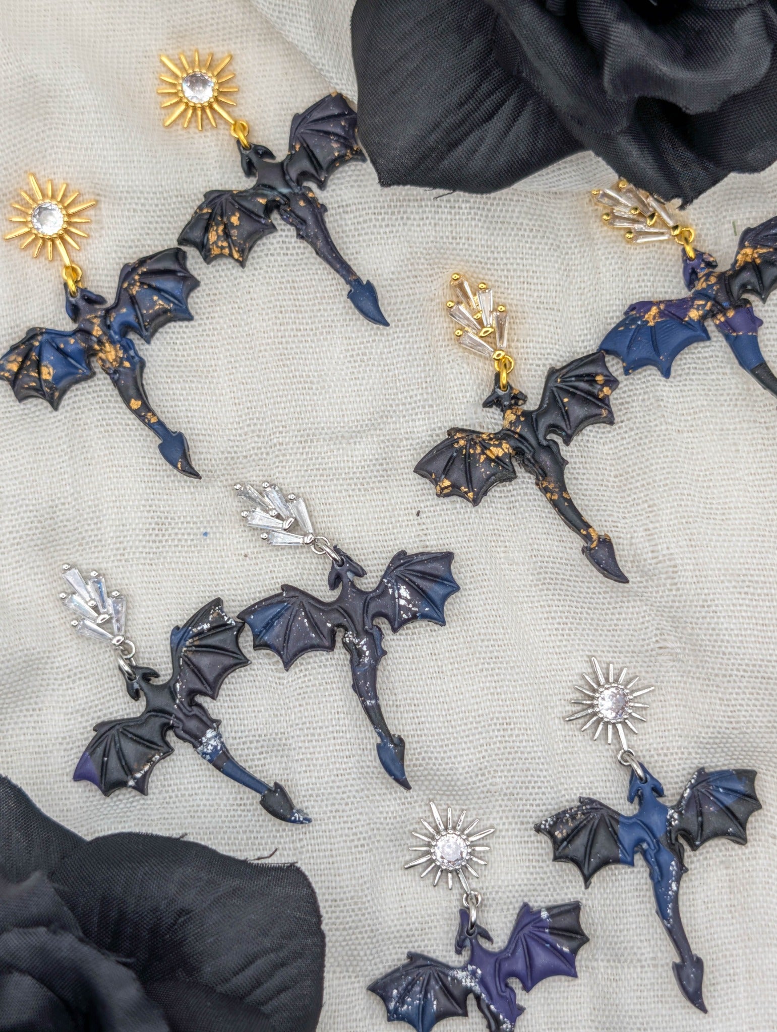 Gold- and silver-flecked small midnight marble dragon earrings with starburst and leaf cubic zirconia studs