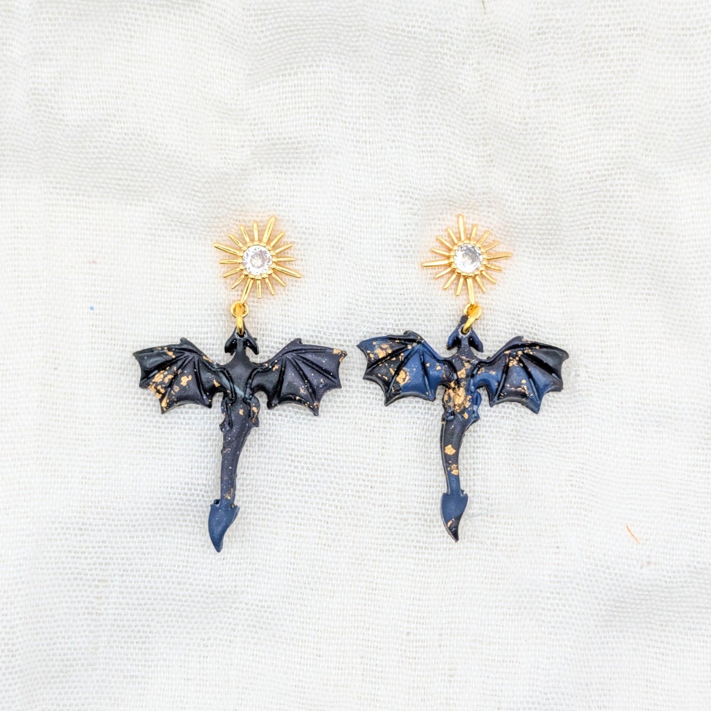 Small gold-flecked midnight marble dragon earrings with 24K gold-plated starburst cubic zirconia studs