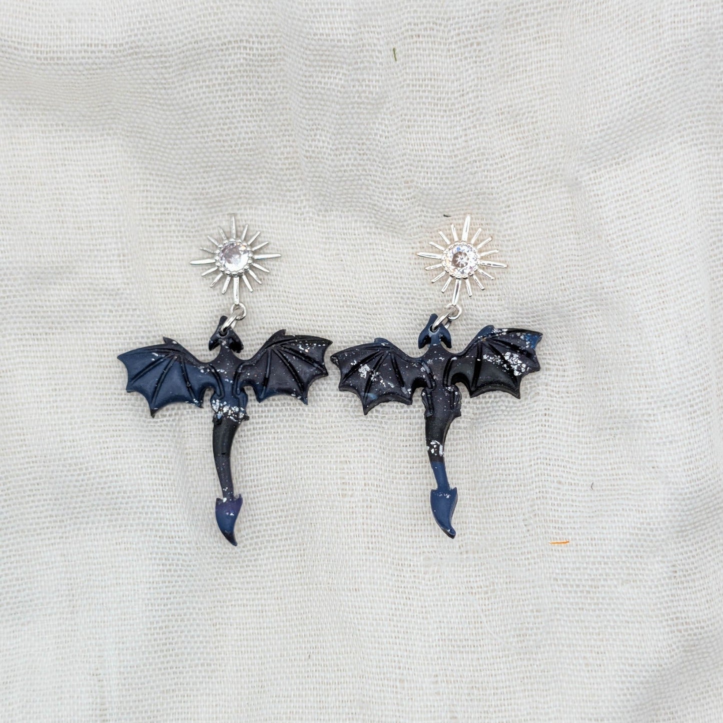 Small silver-flecked midnight marble dragon earrings with silver starburst cubic zirconia studs