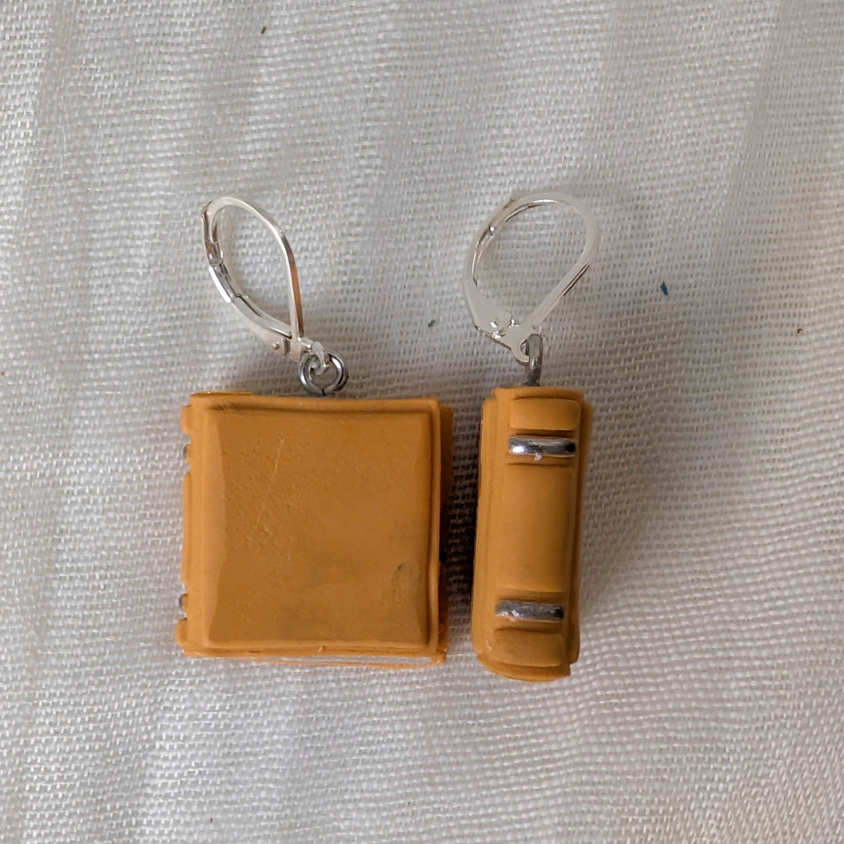 Smooth Mustard Yellow book earrings with silver binding accents and silver findings