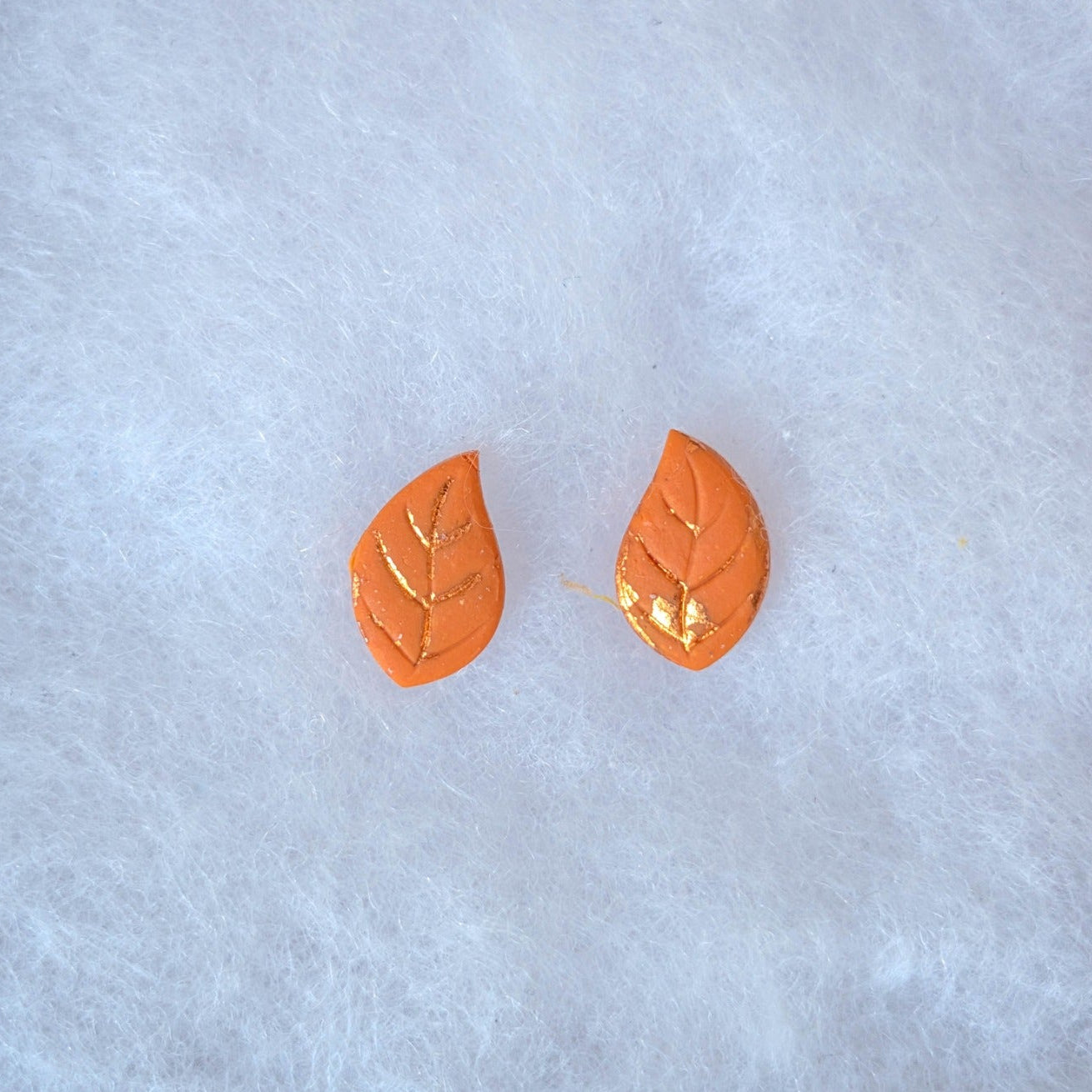 Orange autumn leaf stud earrings with copper veins and edging