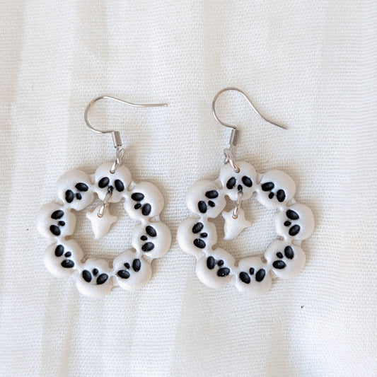 Pearlescent white skull wreath Halloween earrings with black details and dangling ghosts