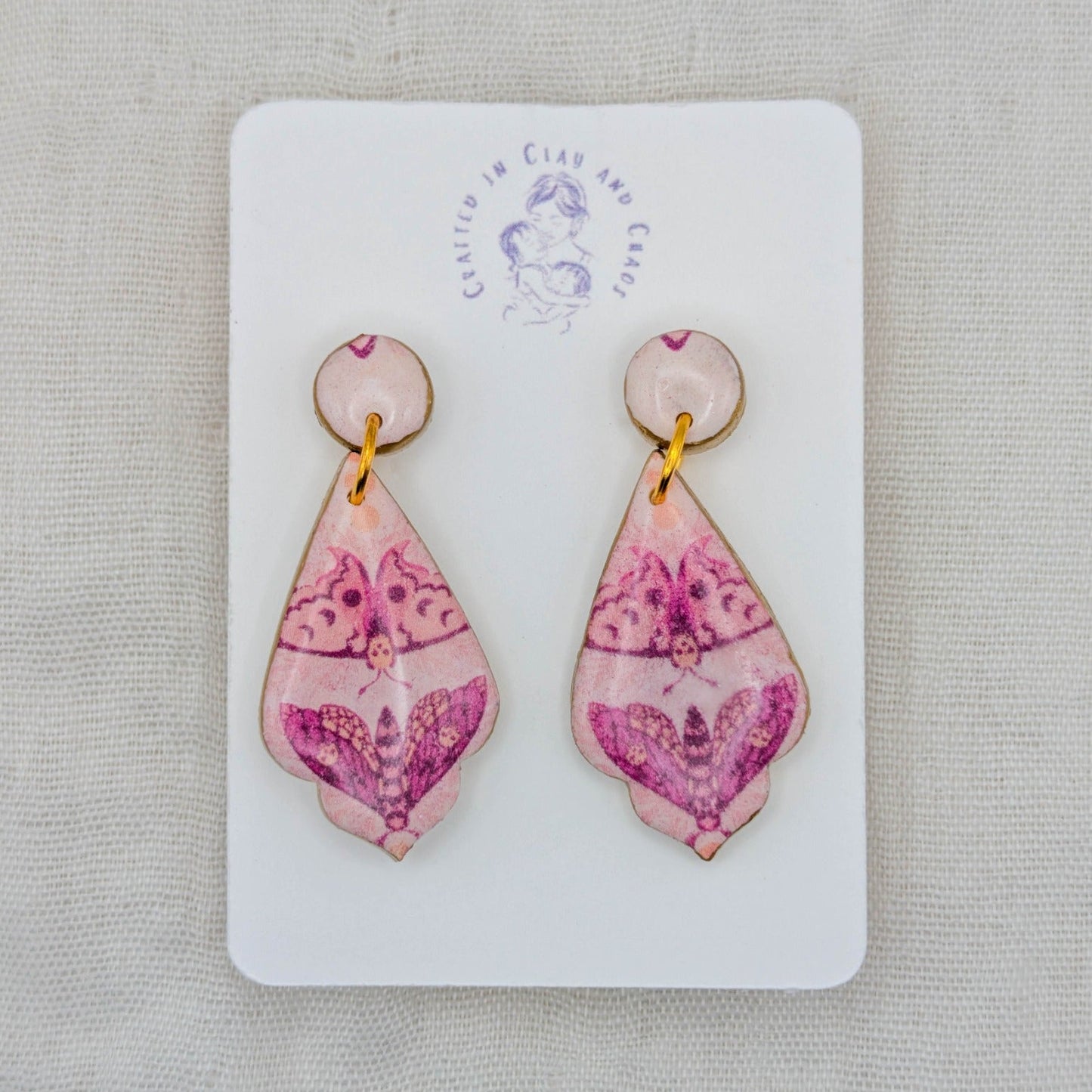 Pink moth pointed teardrop earrings with gold accents and glossy resin topcoat