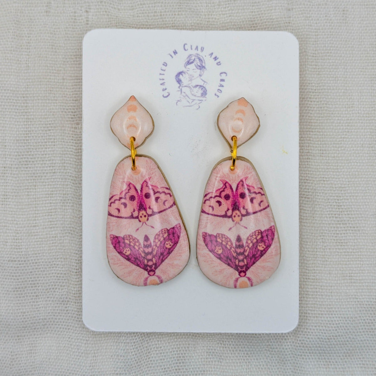 Pink moth rounded teardrop earrings with pointed studs and gold-toned accents