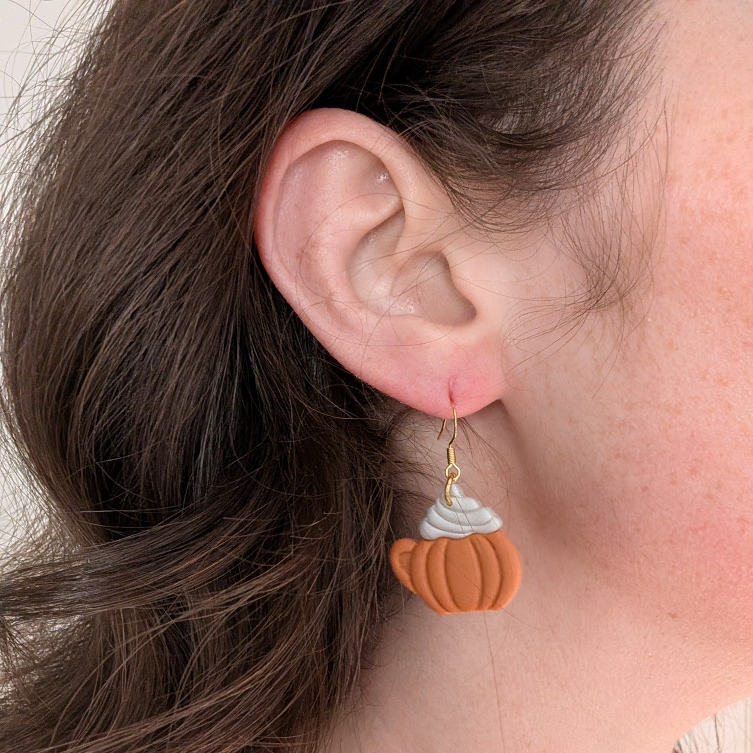 Pumpkin spice latte mug earring worn on ear