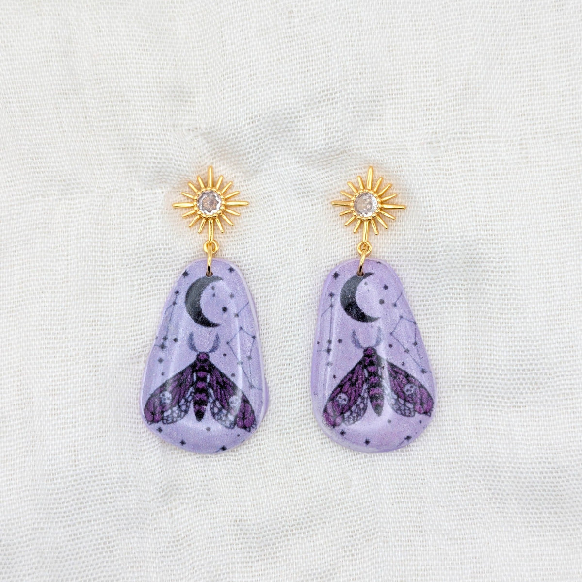 Lavender moth rounded teardrop earrings with gold cubic zirconia starburst posts