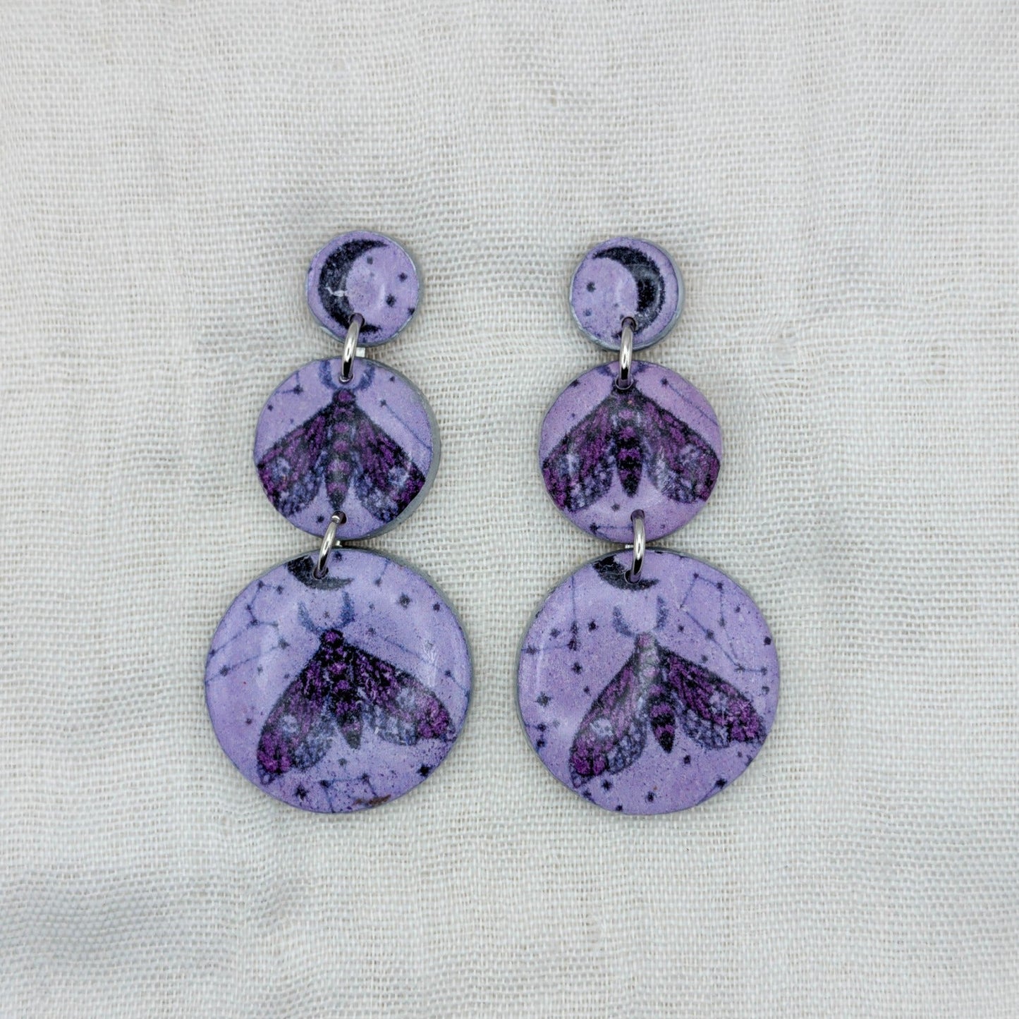 Purple celestial moth triple circle earrings with moon and constellation details
