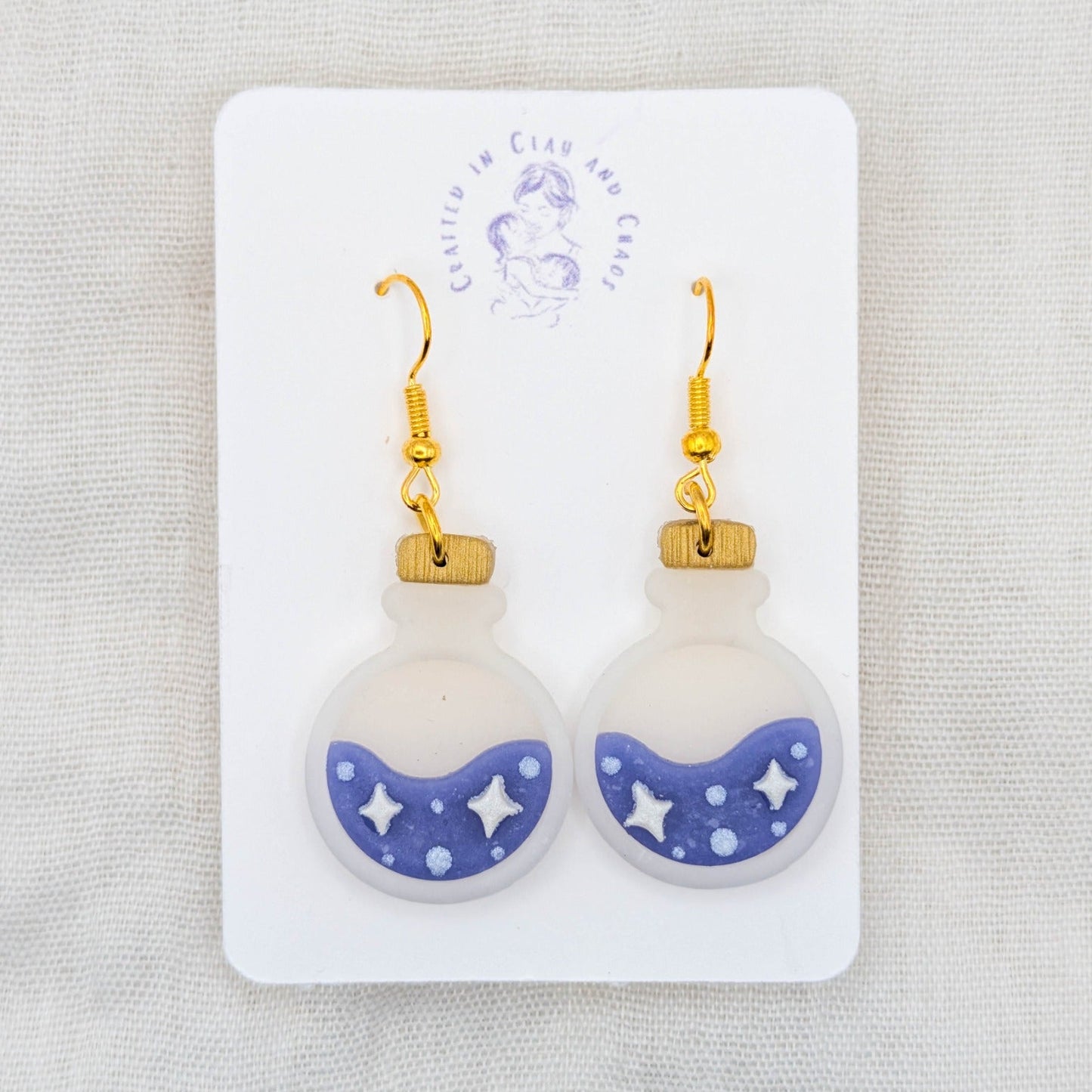 Purple translucent potion bottle earrings with celestial details and 18K gold-plated stainless steel hooks