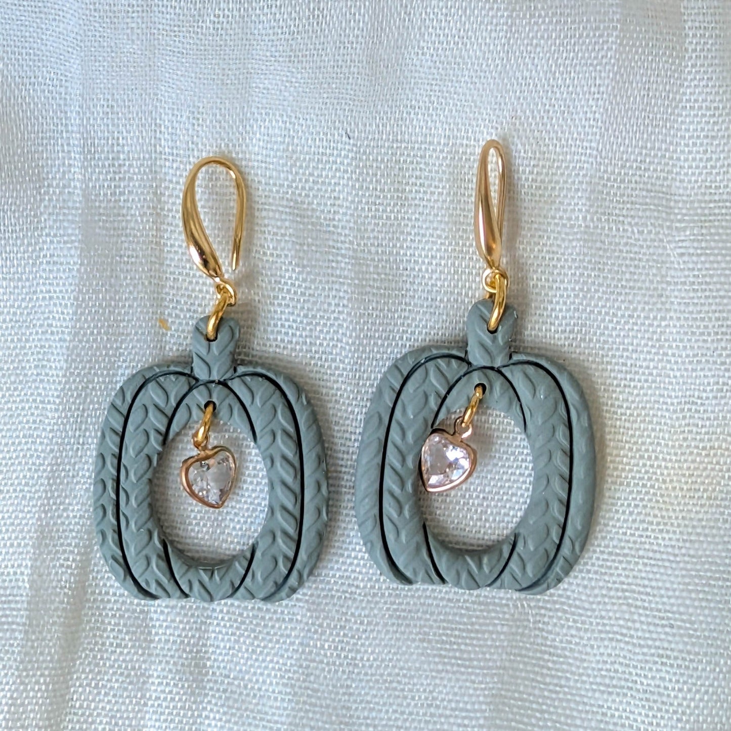 Sage Green knitted pumpkin earrings with clear heart charms and 14K gold-plated stainless steel hooks