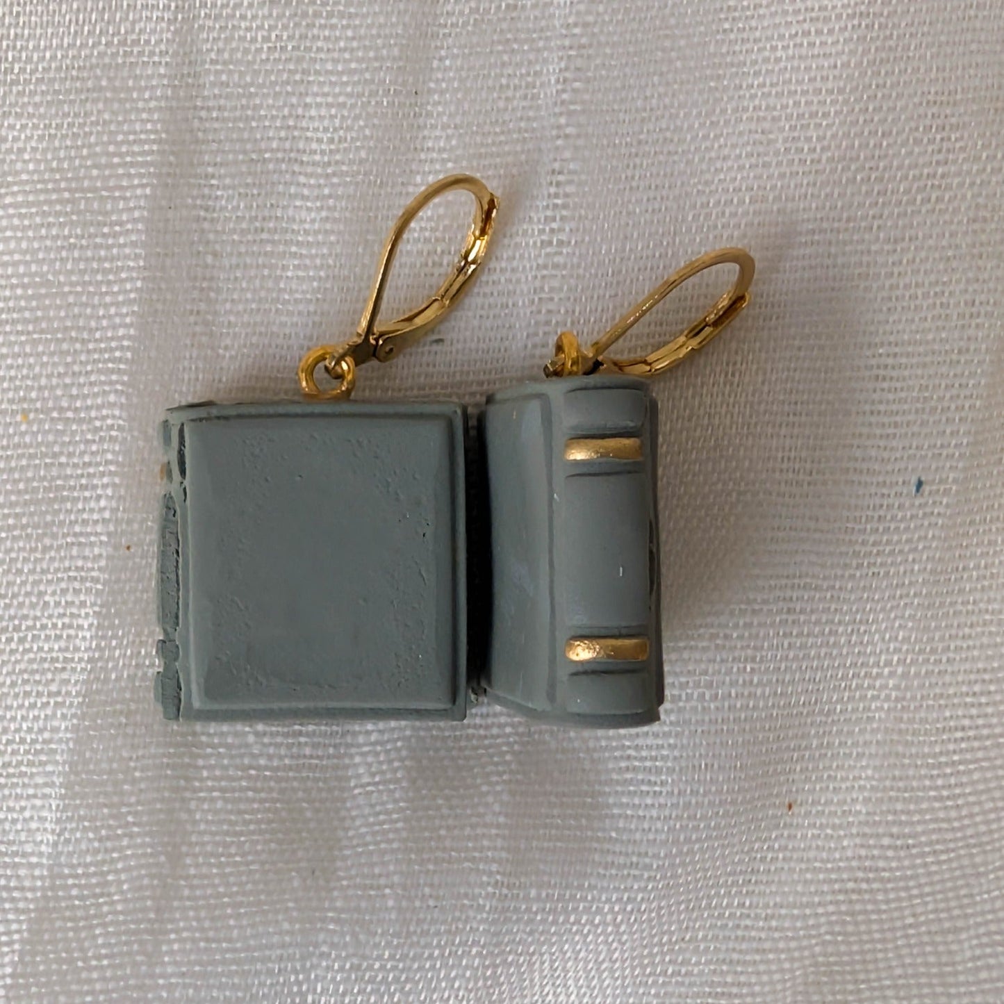 Smooth Sage Green book earrings with gold binding accents and gold findings