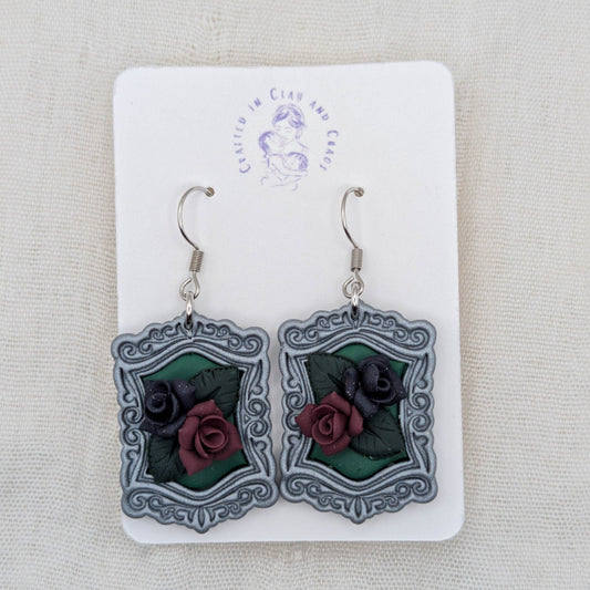 Silver vintage frame earrings with green background, sculpted burgundy and dark purple roses, and surgical-grade stainless steel hooks